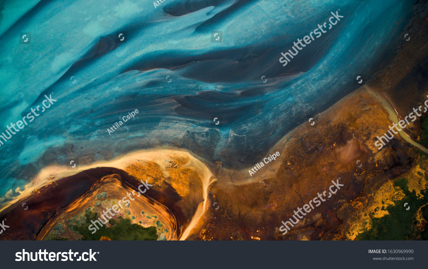 Aerial view from above on a green and blue glacier river stream in 
South Iceland. Beautiful patterns, textures and structures. Melting glacier,  Global warming and climate change concept #1630969990