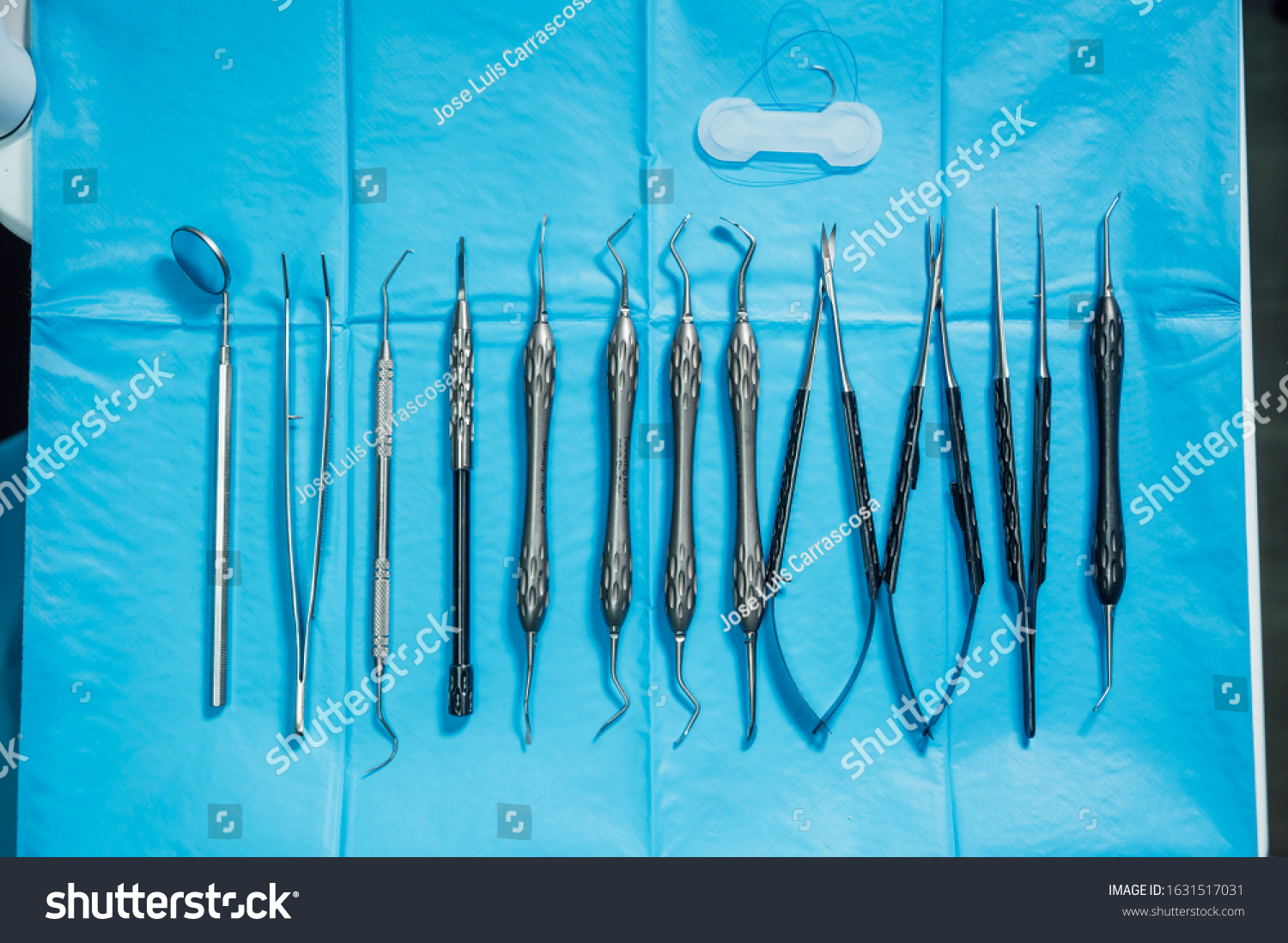 Detail of hand holding dental tools in dental clinic. Dental clinic. #1631517031