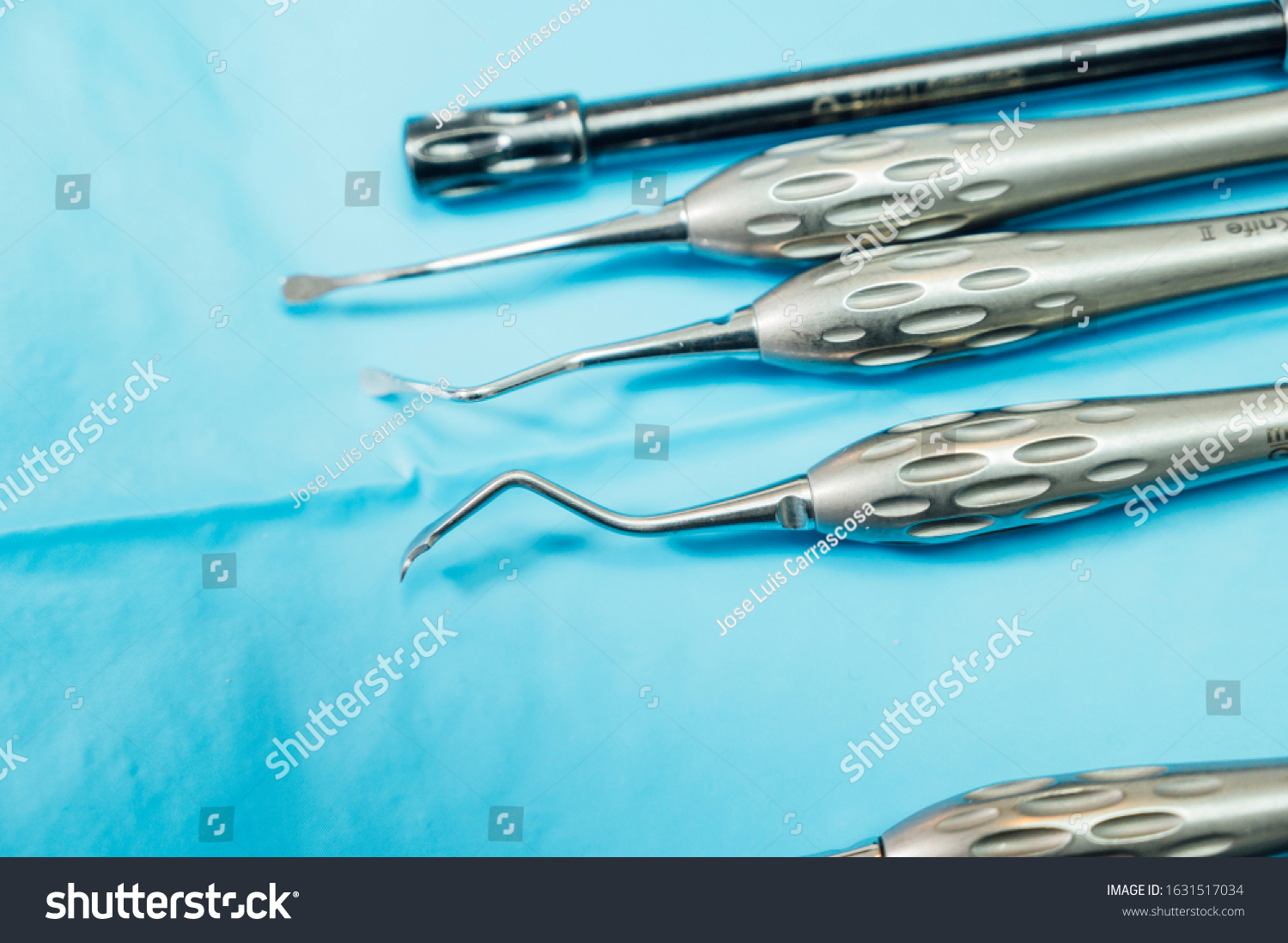 Detail of hand holding dental tools in dental clinic. Dental clinic. #1631517034