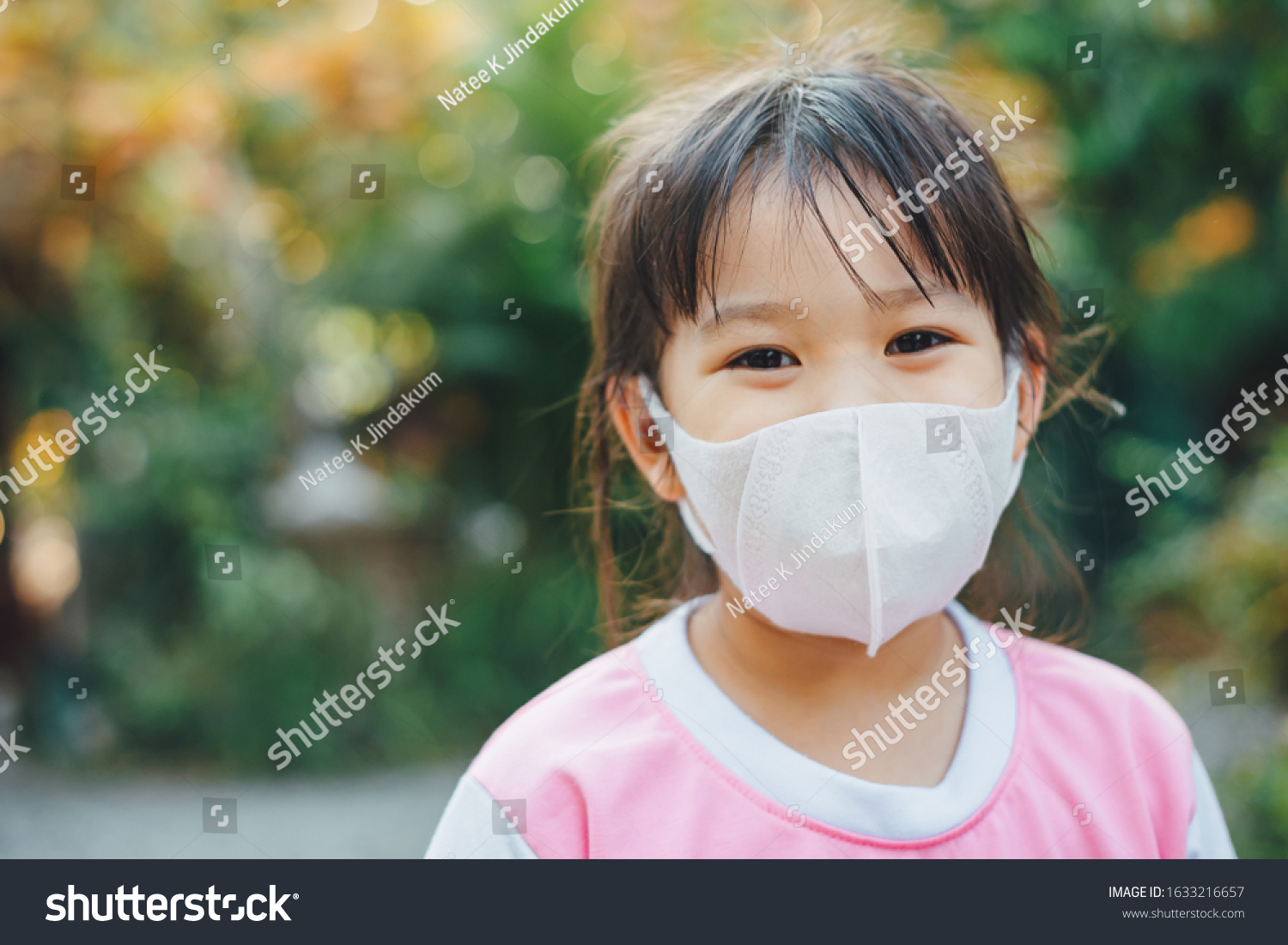 Kids wearing the mask for protect them self from virus and air pollution. Prevention by mask to reduce spread of the coronavirus (covid-19) outbreak from human to human transmission. #1633216657