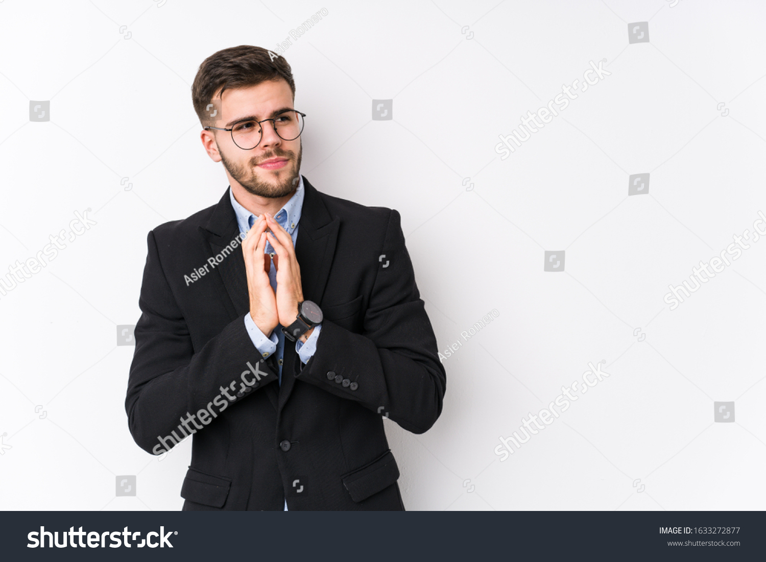 Young caucasian business man posing in a white background isolated Young caucasian business man making up plan in mind, setting up an idea. #1633272877
