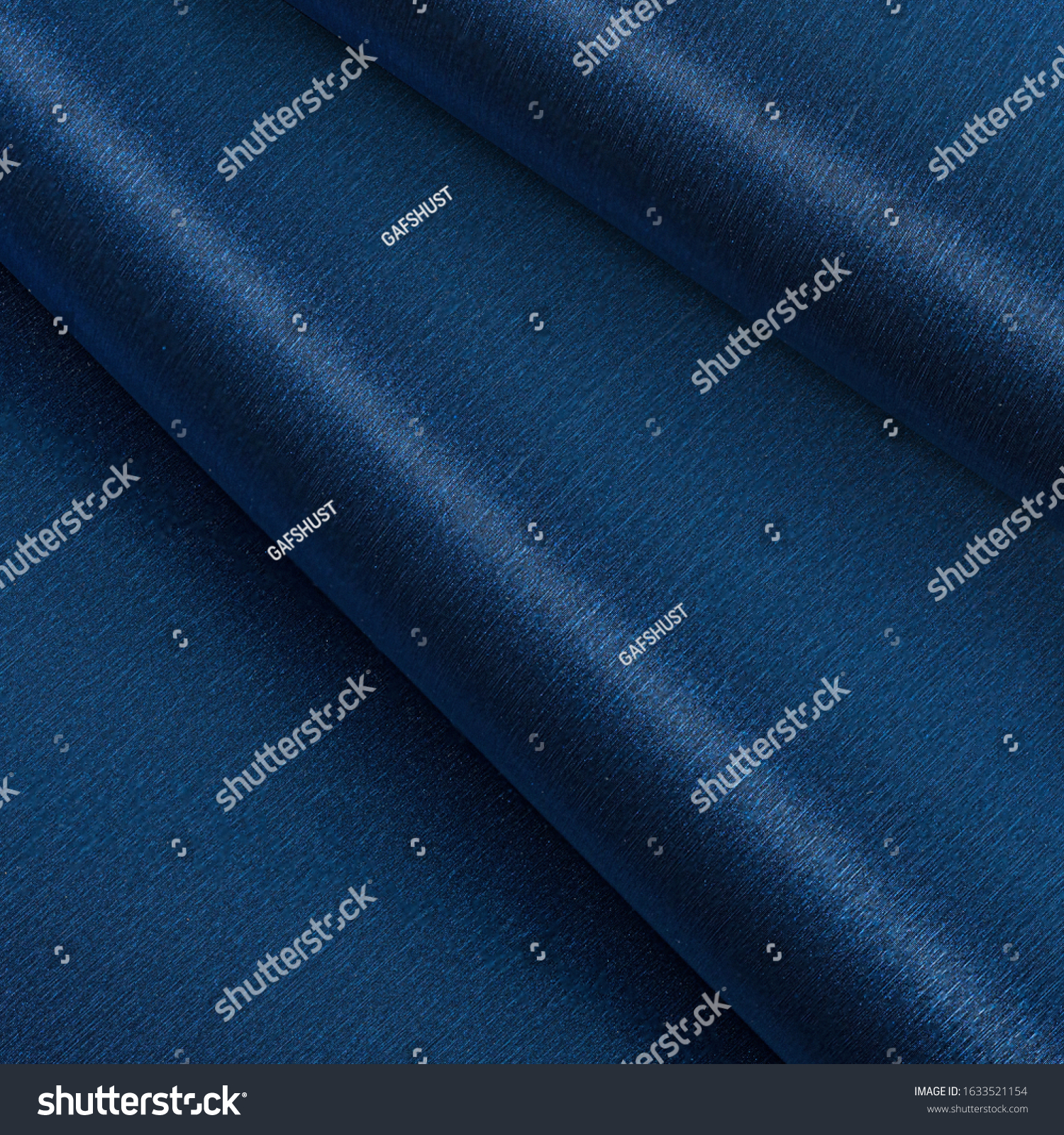 leatherette folds creased folds texture blue shiny flickering wave.
High resolution photo. #1633521154