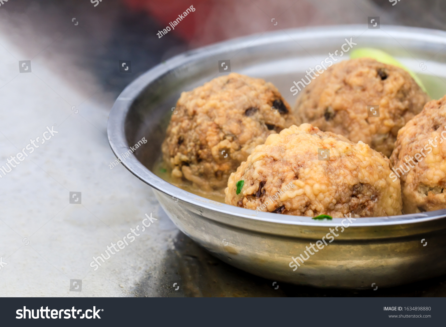 Cooked deep-fried meatballs made from cooked pork and cooked rice.Chinese food. #1634898880