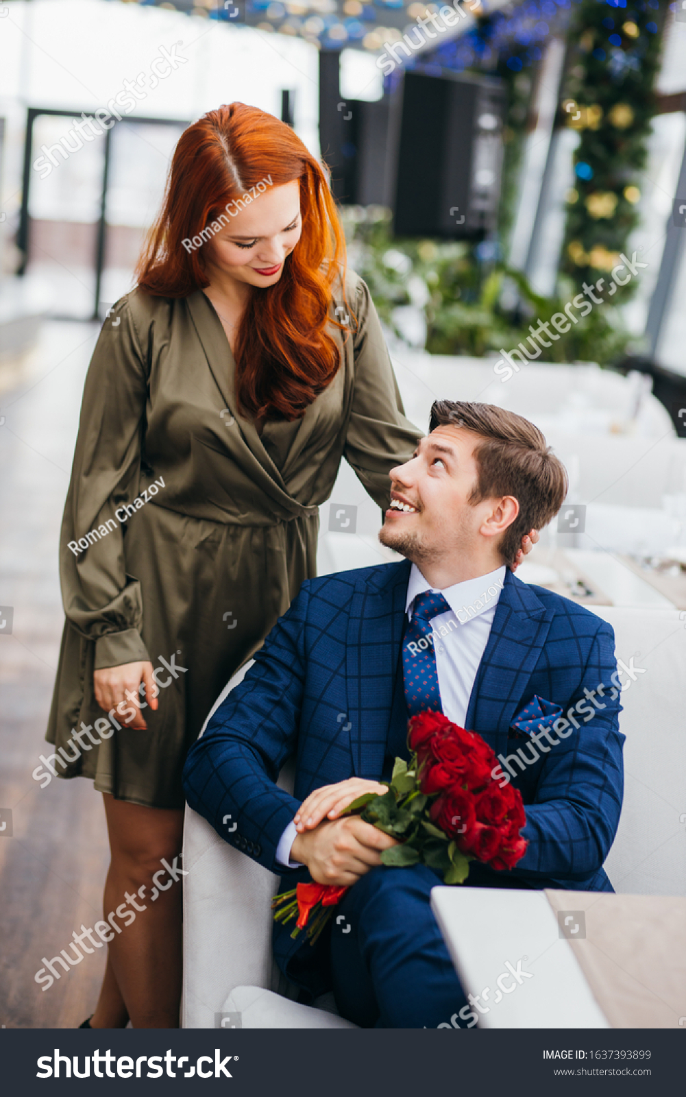 beautiful caucasian couple on a date in rich restaurant, celebrating birthday or anniversary together, two people in love. relationship, love concept #1637393899