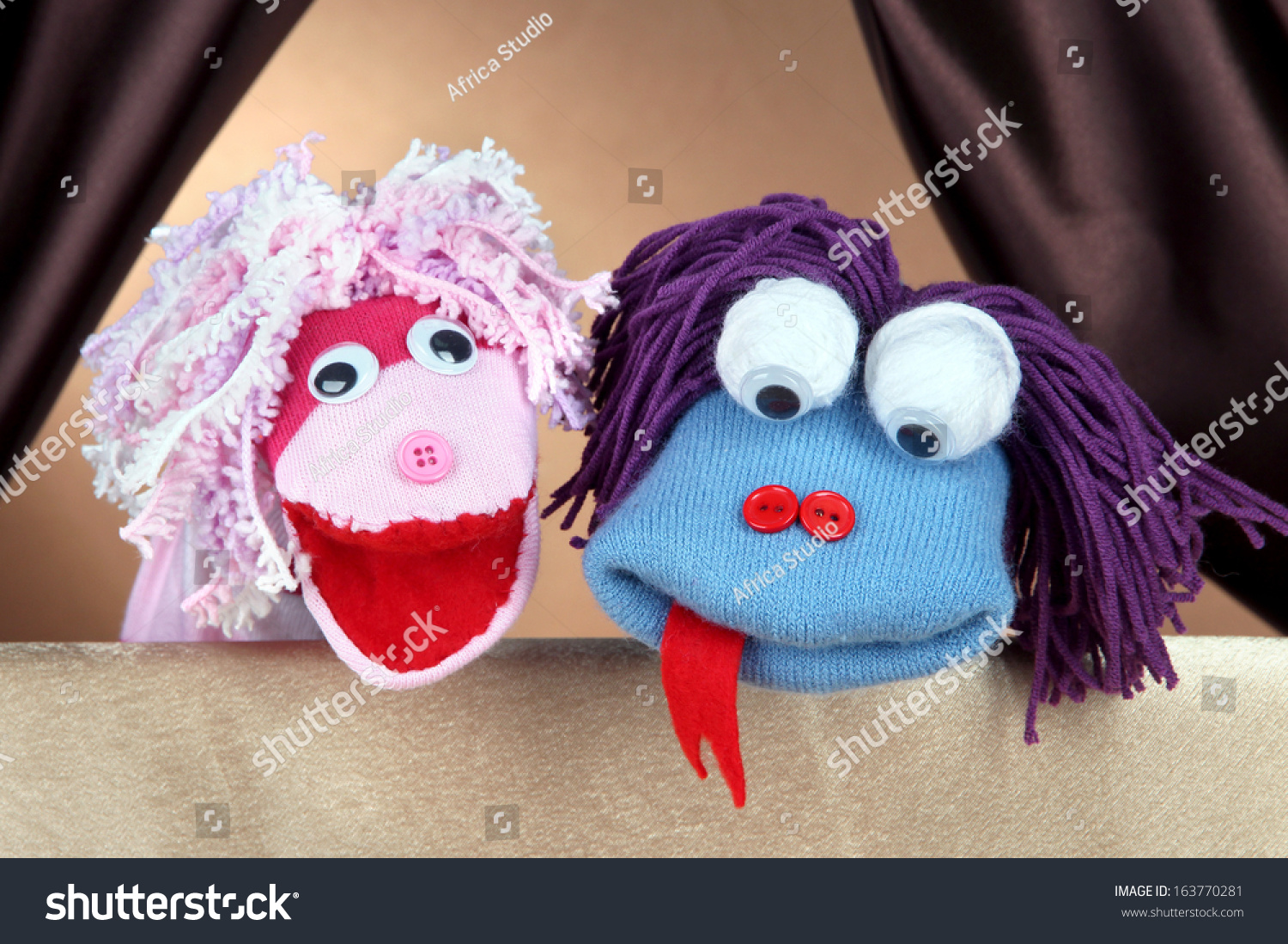 Puppet show on brown background #163770281