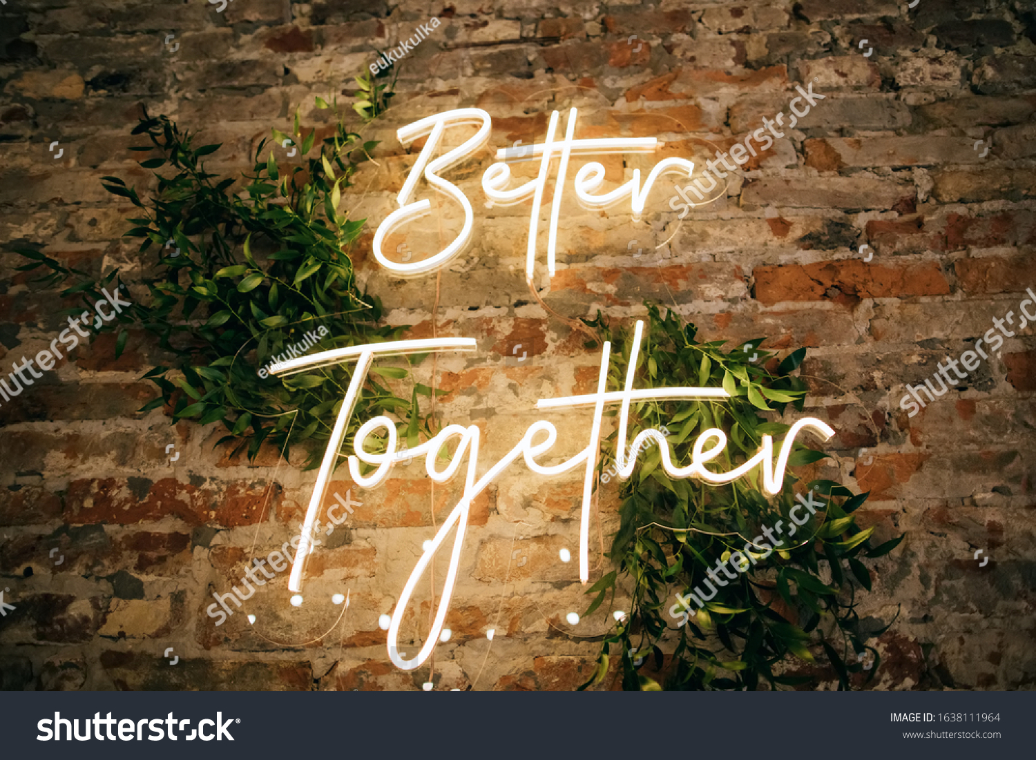 Better Together - neon sign on a brick wall in a restaurant at a wedding party. Love concept #1638111964