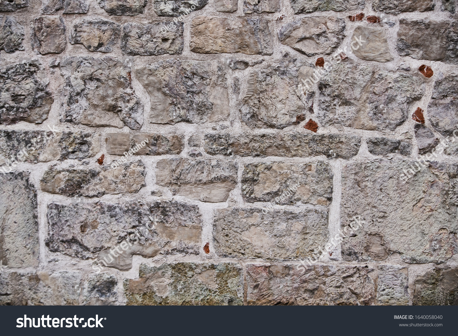 Texture of a stone wall. Old castle stone wall texture background. Stone wall as a background or texture. Part of a stone wall, for background or texture #1640058040