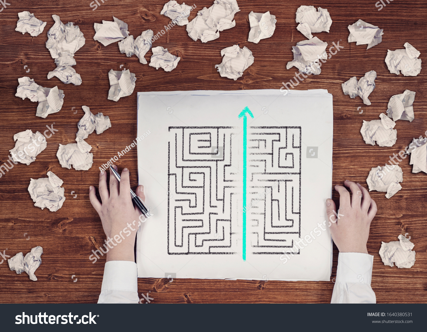 Shortcut of a maze drawn on paper . Crumpled papers arround. Easy solution of a difficult problem. #1640380531