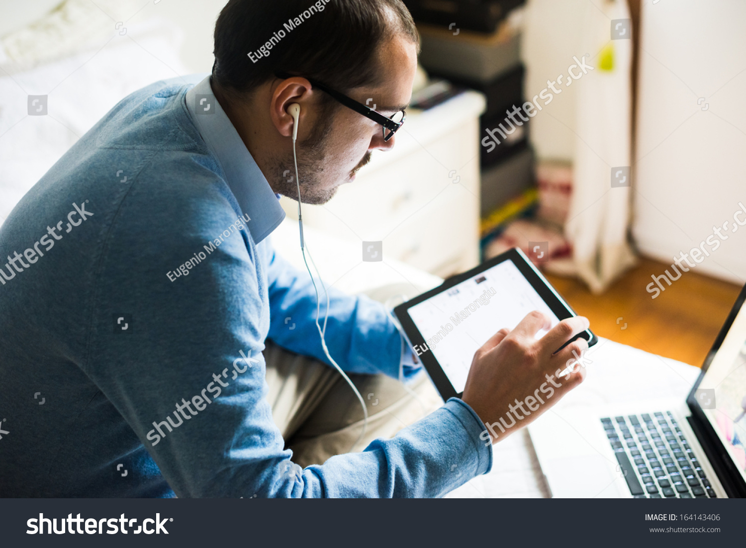 elegant business multitasking multimedia man using devices at home #164143406