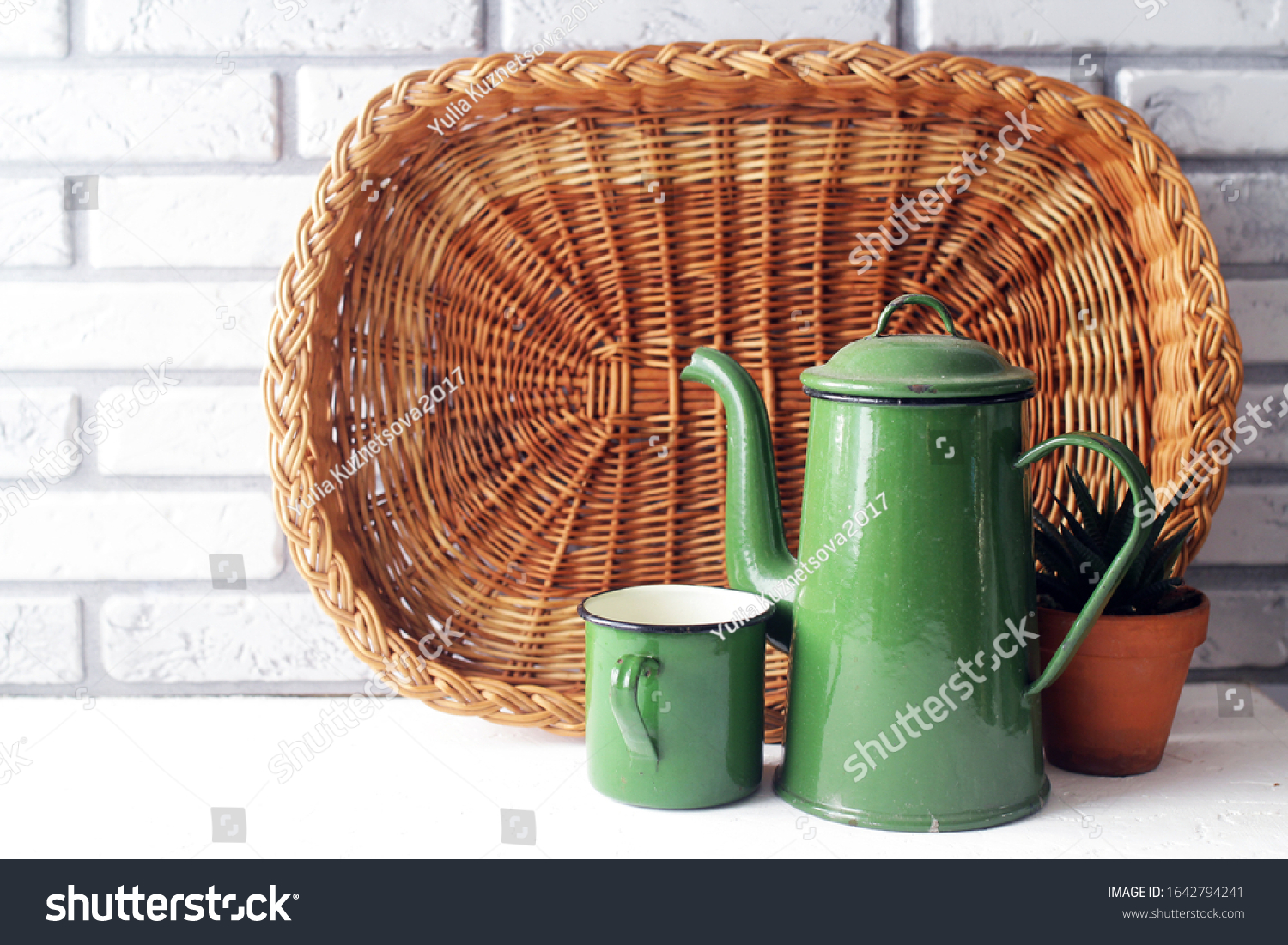 vintage coffeepot cups on rustic kitchen, with coffee and cooking theme, rural style #1642794241