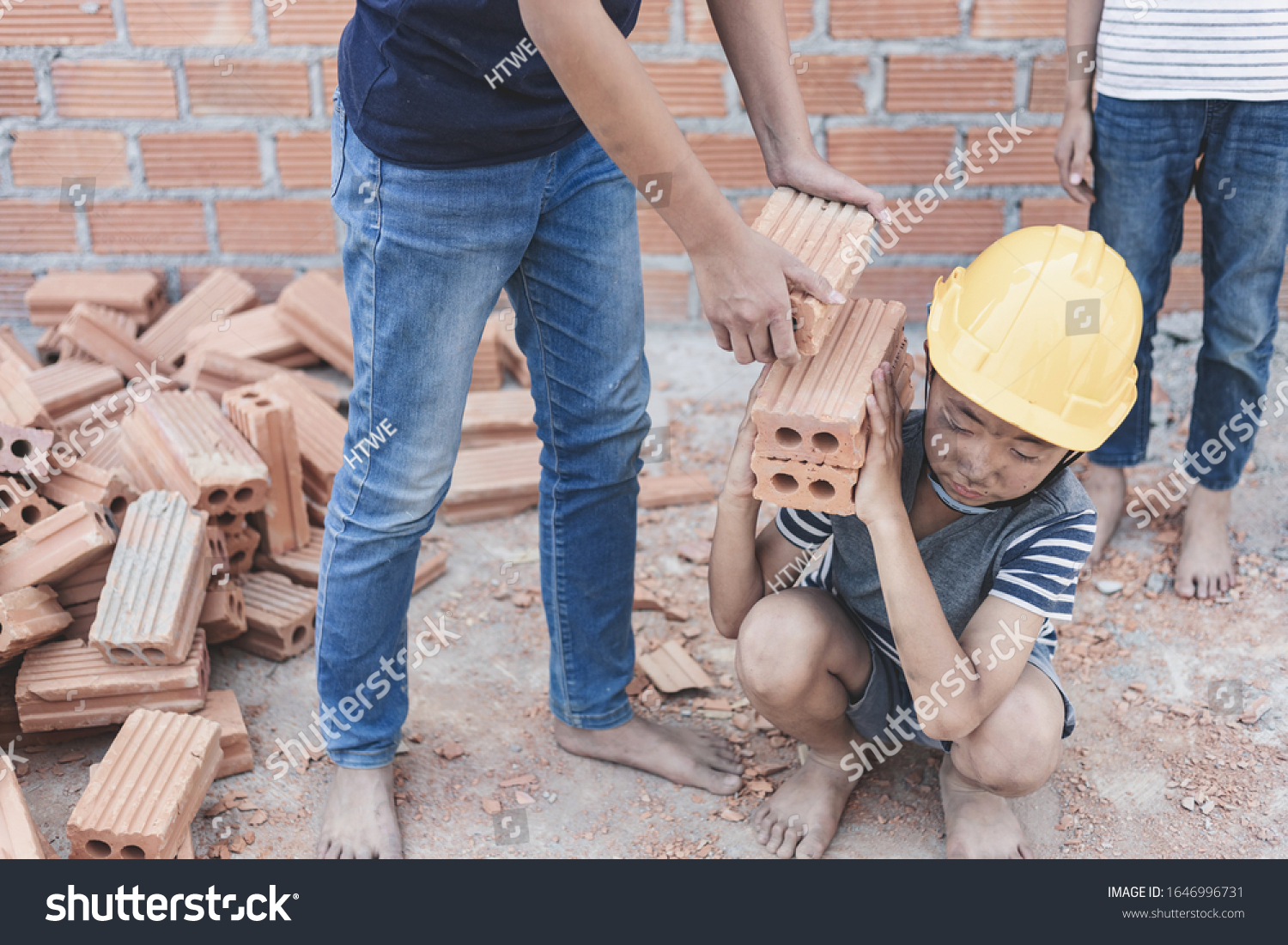 Children working at construction site for world day against child labor concept: #1646996731