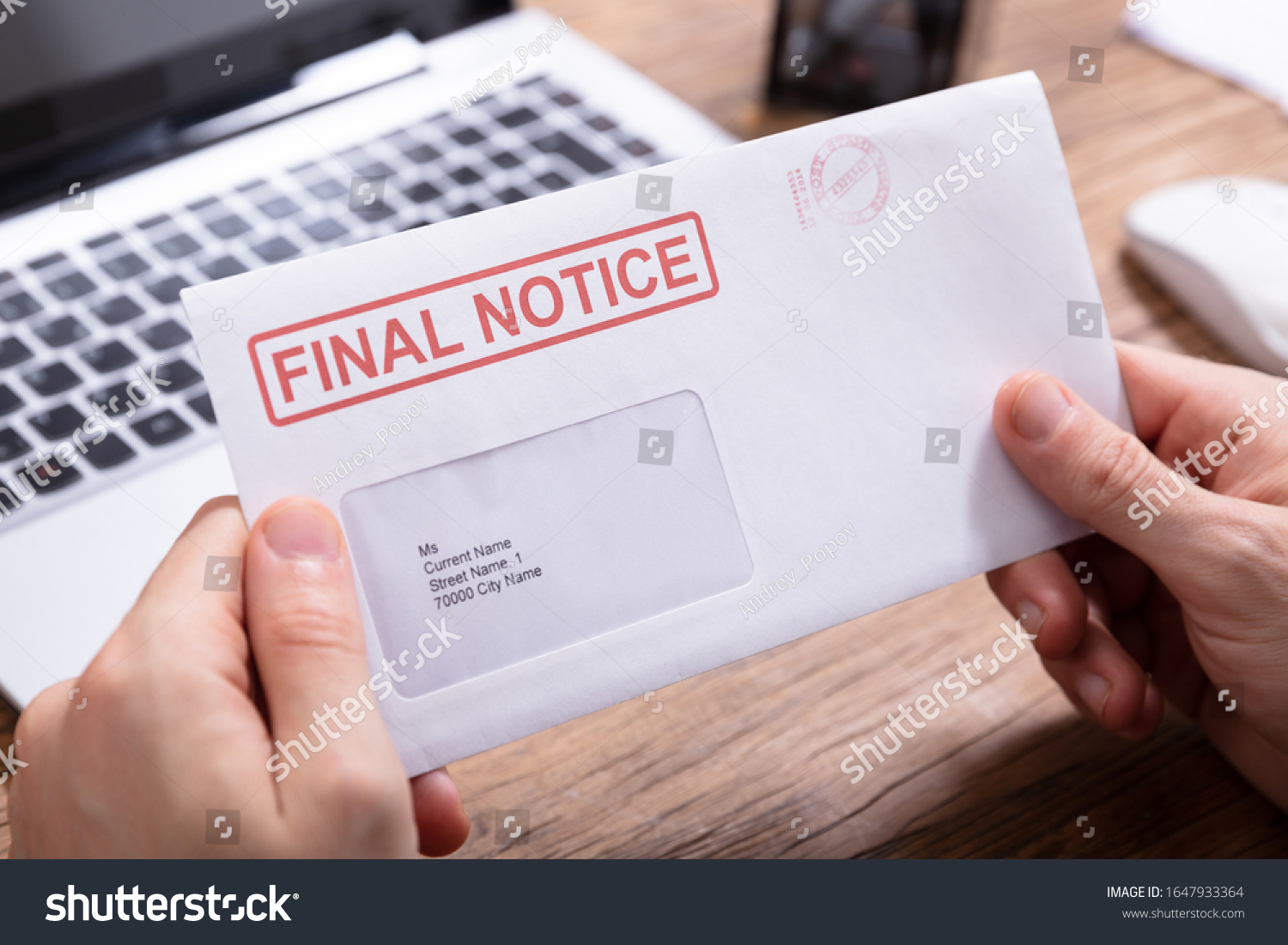 Close-up Of Person's Hand Holding Final Notice Envelope #1647933364