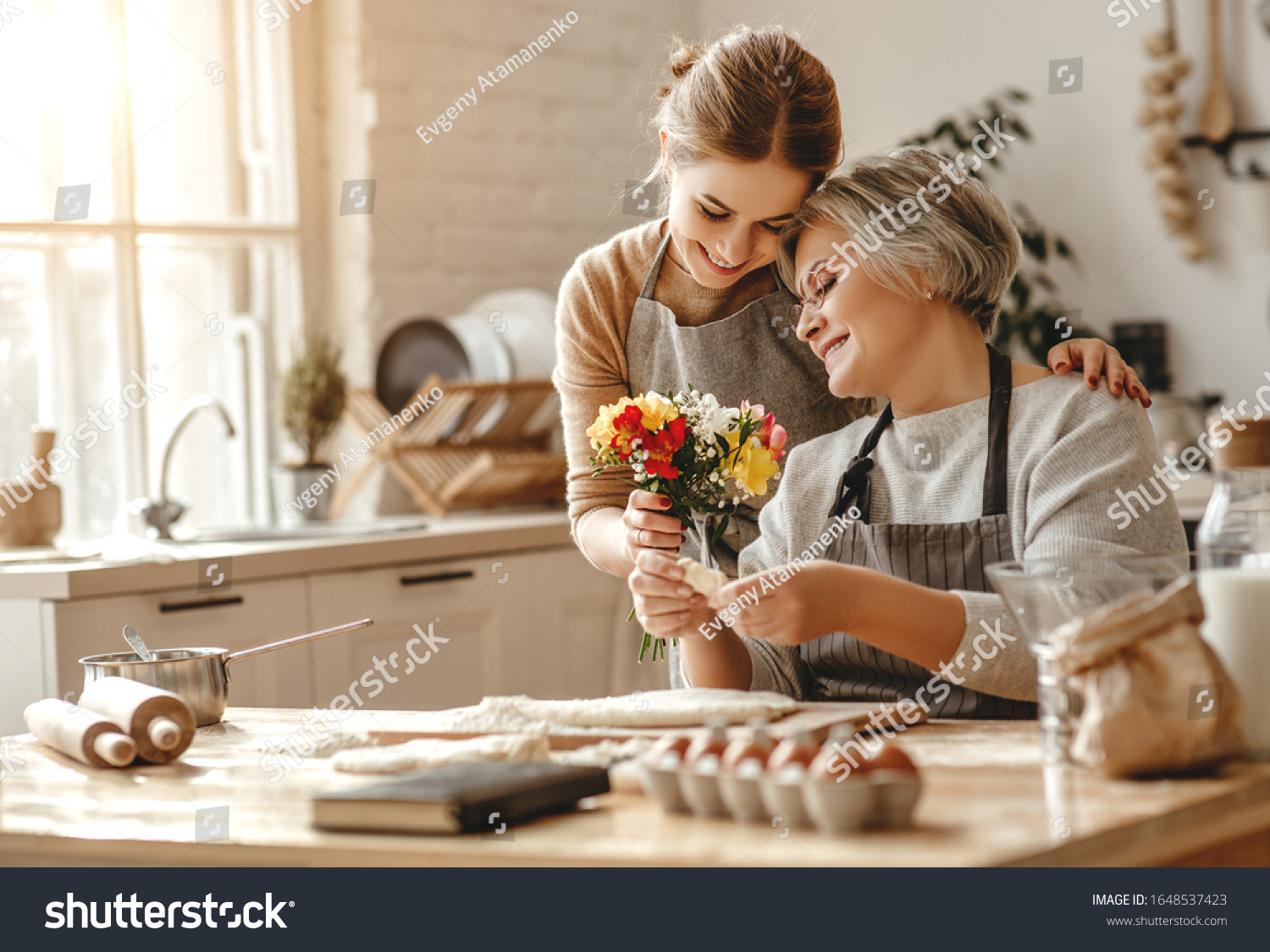 happy mother's day! family old grandmother mother-in-law and daughter-in-law daughter congratulate on the holiday, give flowers 
 #1648537423