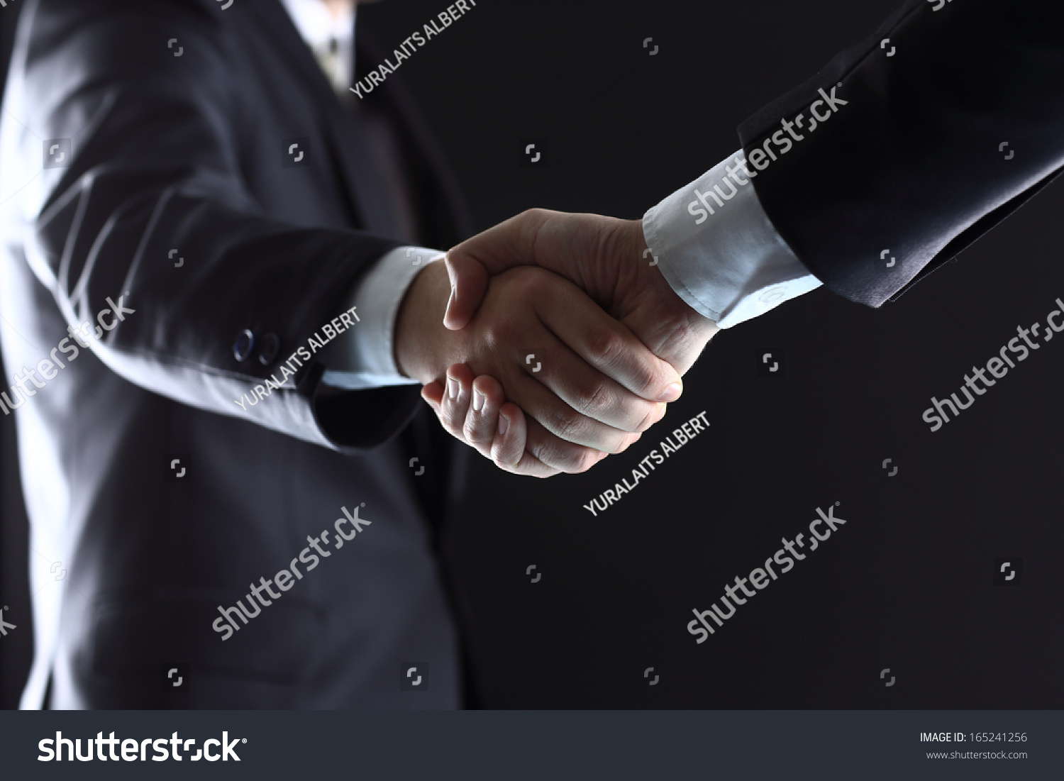 Business people shaking hands, finishing up a meeting #165241256