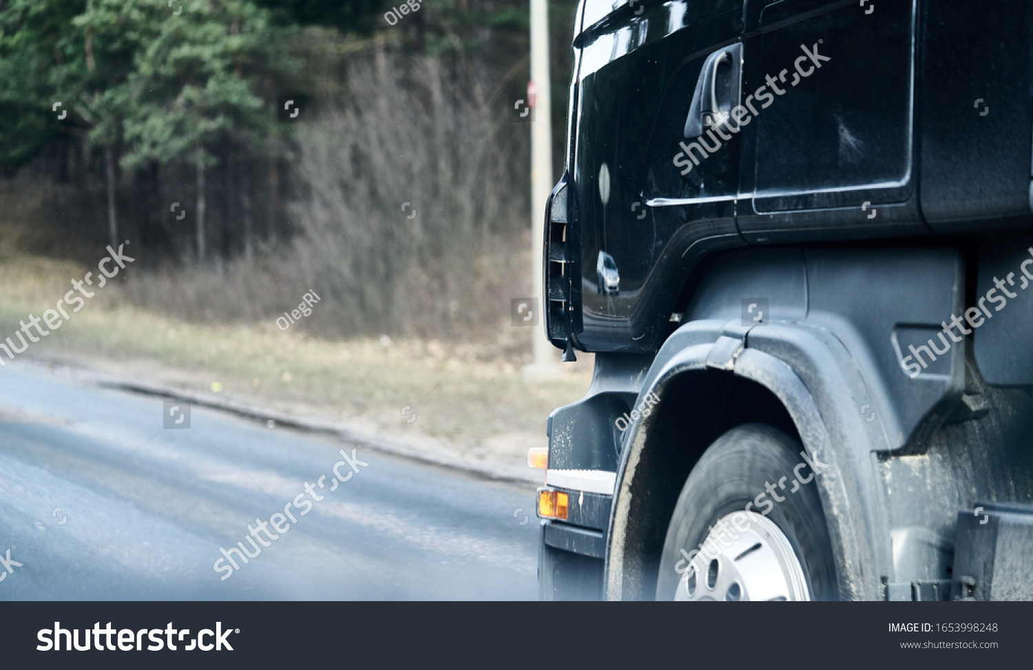 Truck wheel in rotation. Close up photo. Motion blur. Selective focus #1653998248