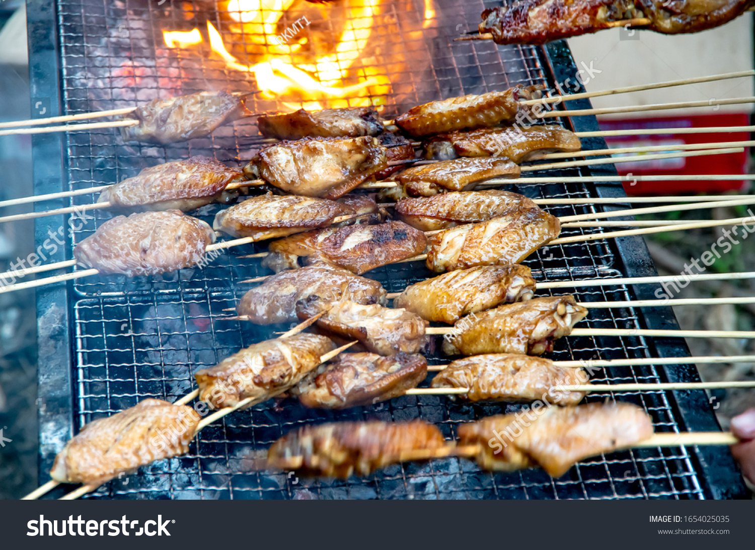Delicious outdoor grilled chicken wings #1654025035