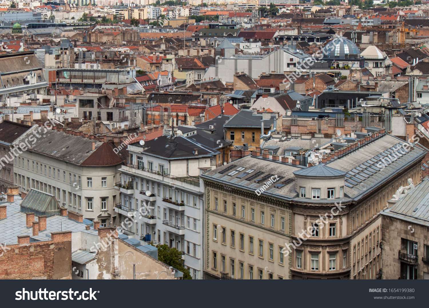 Skyline of Budapest, Hungary, Europe. Rooftop view from the tower of St. Stephen's Basilica. Historical buildings, towers and colorful rooftops. European capital city skyline. #1654199380