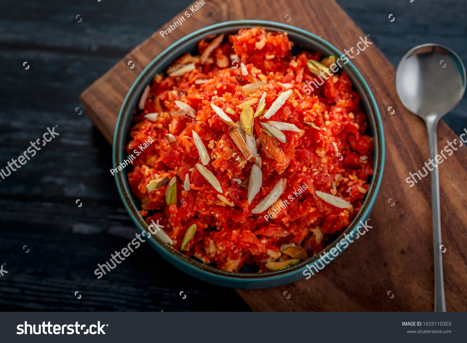 
Gajar ka halwa is a sweet dessert pudding from India made from carrot, served in a bowl. Garnished with cashew, almond and pistachio nuts. #1655110303