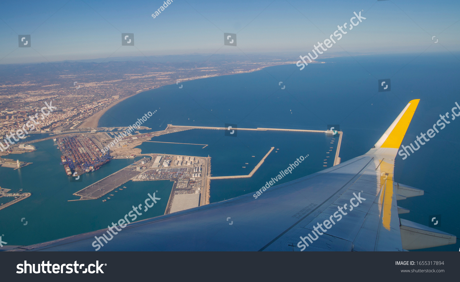 Airplane window overlooking the horizon #1655317894