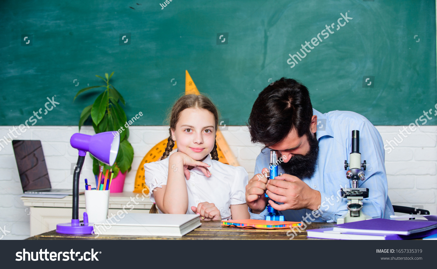Girl pupil study with bearded teacher. Studying methods for children. School education. Extra classes. Cognitive skills concept. Schoolgirl likes study with father. Study hard. Following example. #1657335319