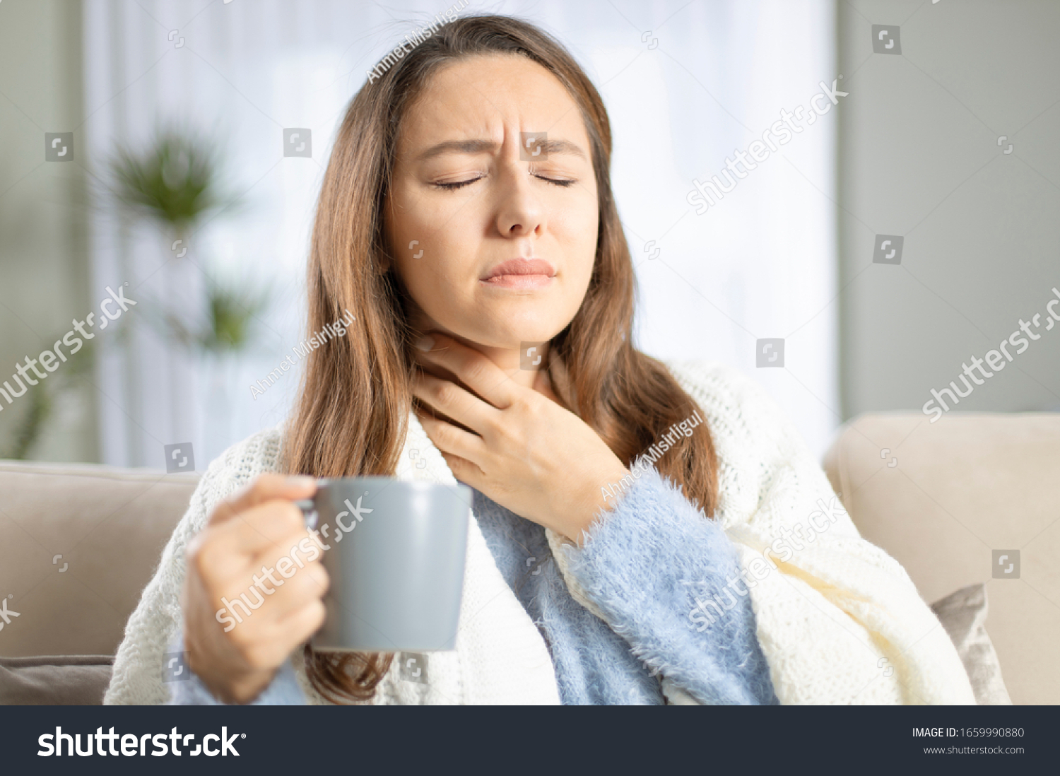 Young woman touching painful neck, sore throat for flu, cold and infection #1659990880