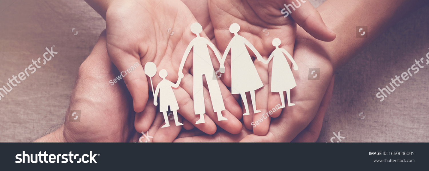Adult and children hands holding paper family cutout, family home, adoption, foster care, homeless support, family mental health, autism support, domestic violence, social distancing concept #1660646005
