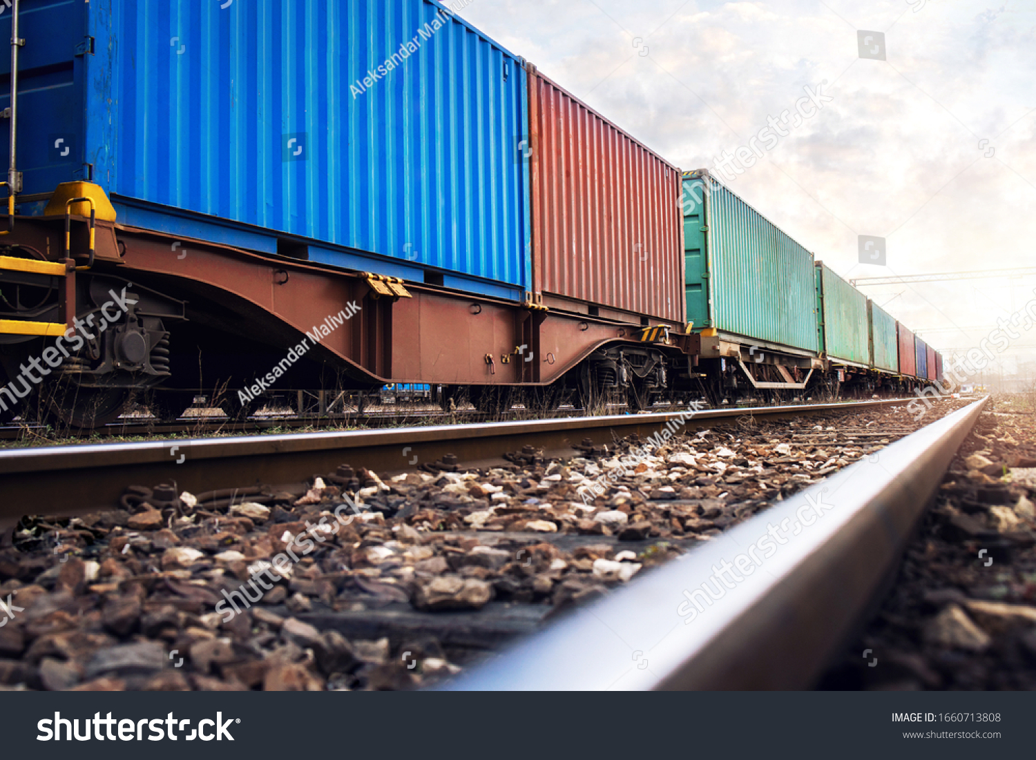 Train wagons carrying cargo containers for shipping companies. Distribution and freight transportation using railroads. #1660713808