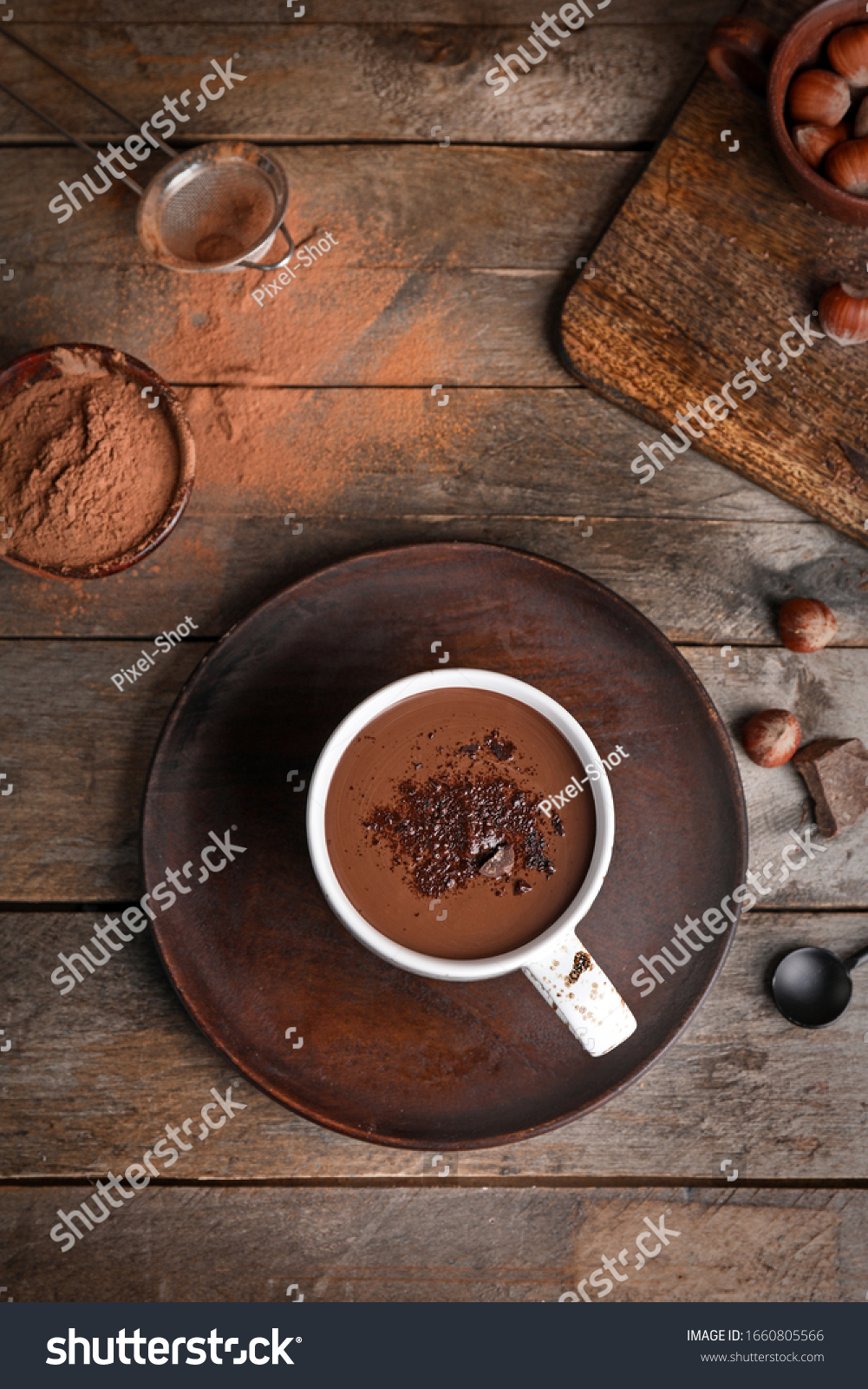 Cup of hot chocolate on wooden table #1660805566