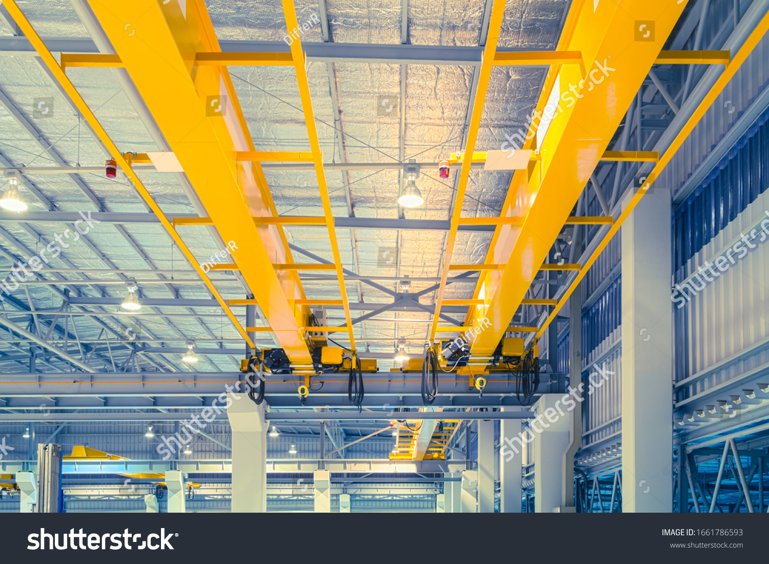 Overhead crane or bridge crane consists of parallel runways with a bridge between column also include hoist lifting and rope.
Machinery for manufacturing or transportation in factory or warehouse.ing. #1661786593