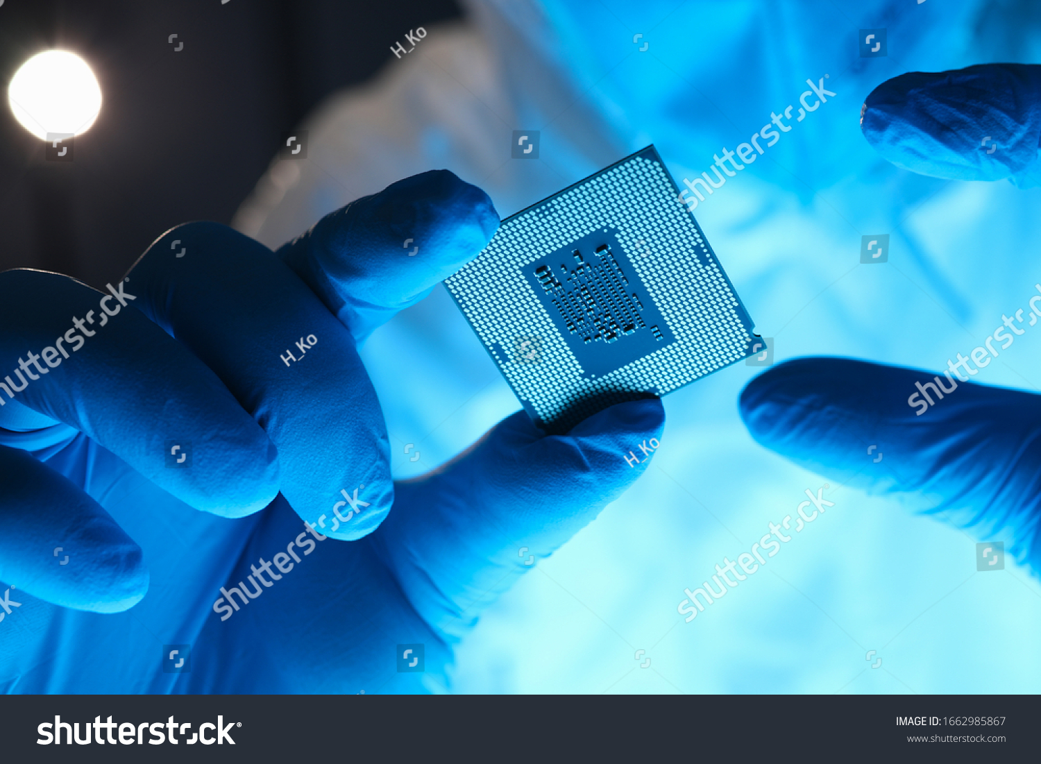 Hands in gloves hold chip testing microelectronics. Setting operating modes electronic controllers. Use chip tuning to increase power. Repair microprocessor electronics electrical equipment #1662985867