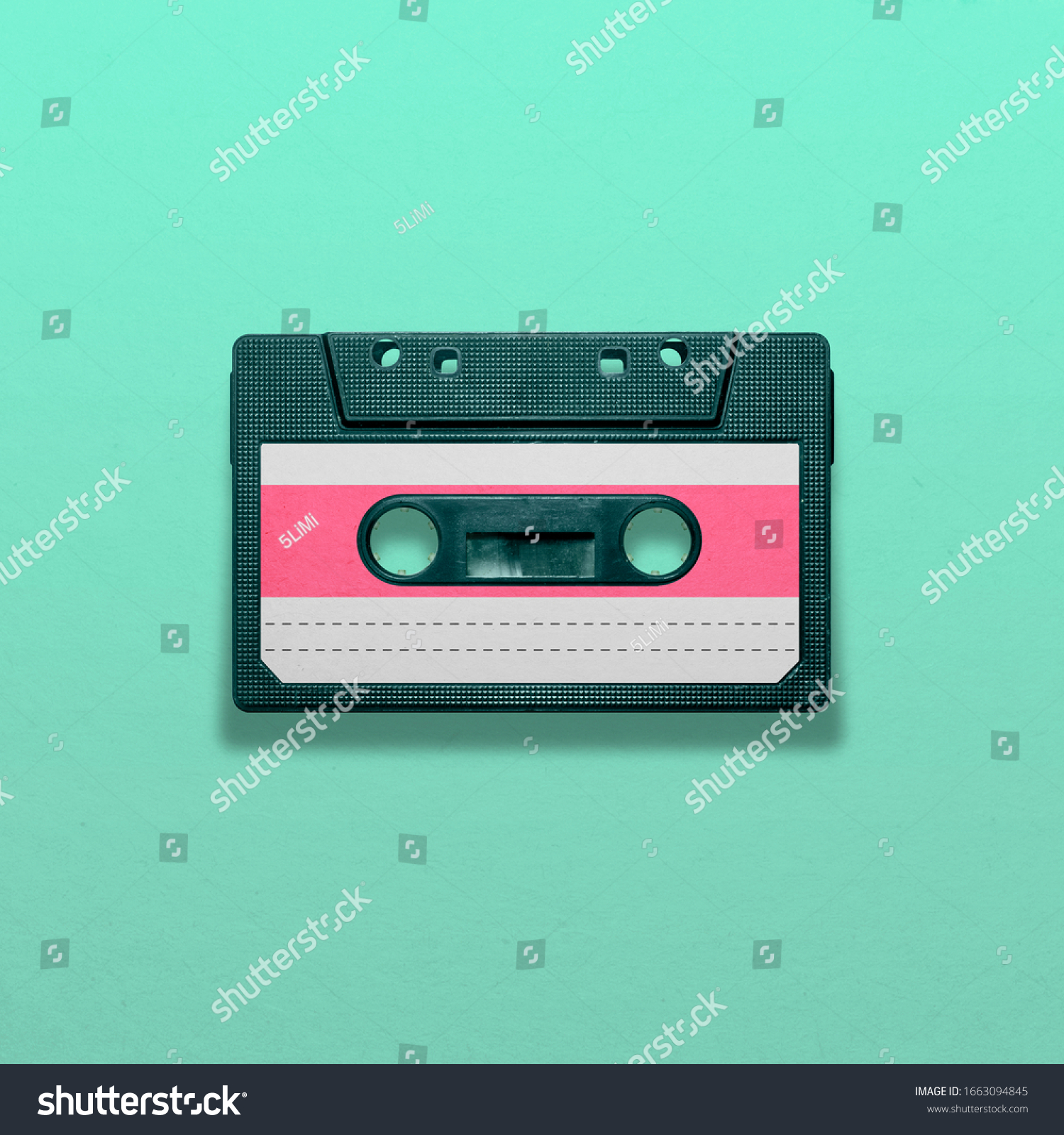 Retro audio cassette isolated on blue background, pop art design, close up #1663094845