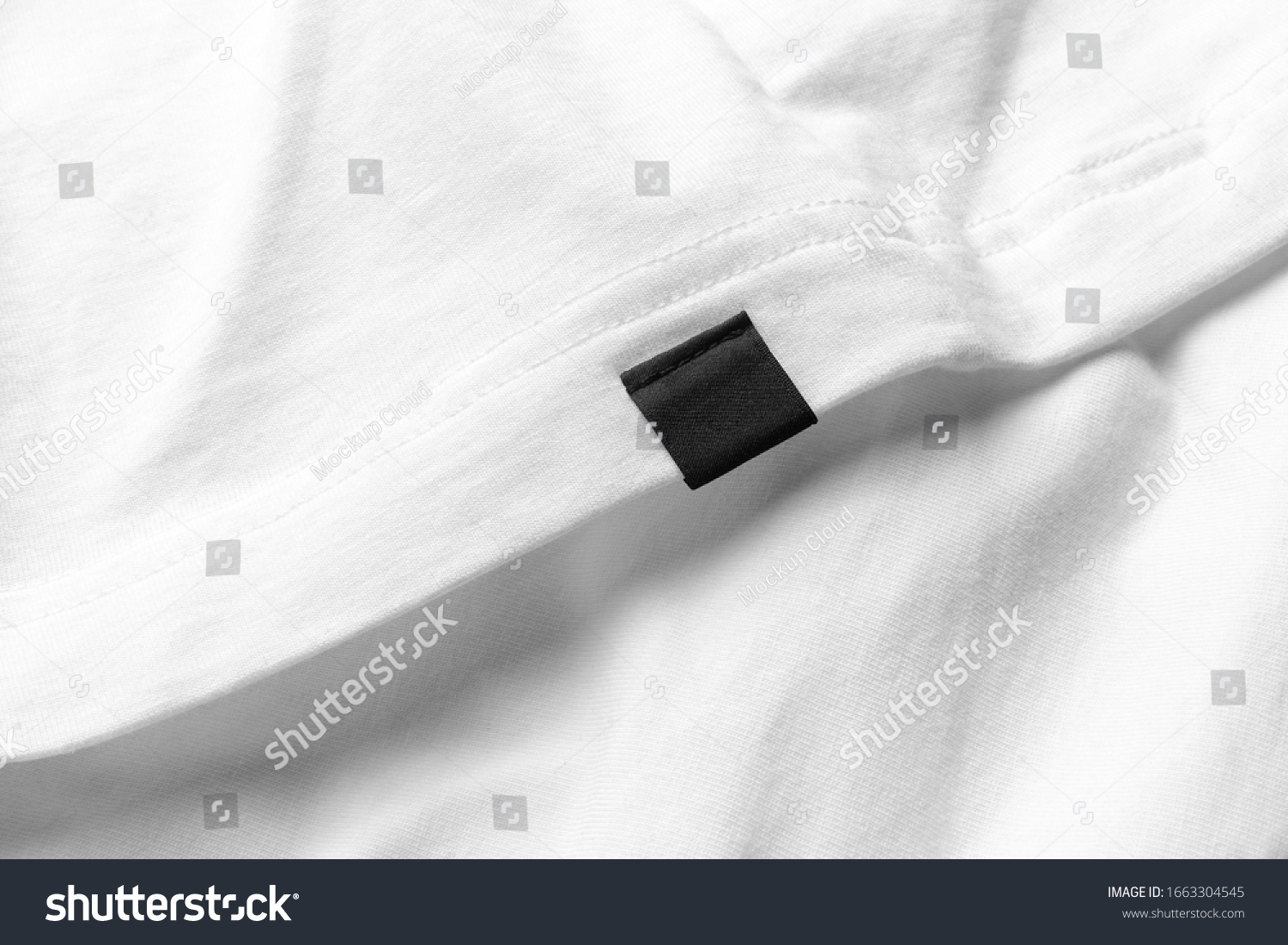 Closeup shirt clothing tag, label blank mockup template, to place your design on a white fabric background #1663304545