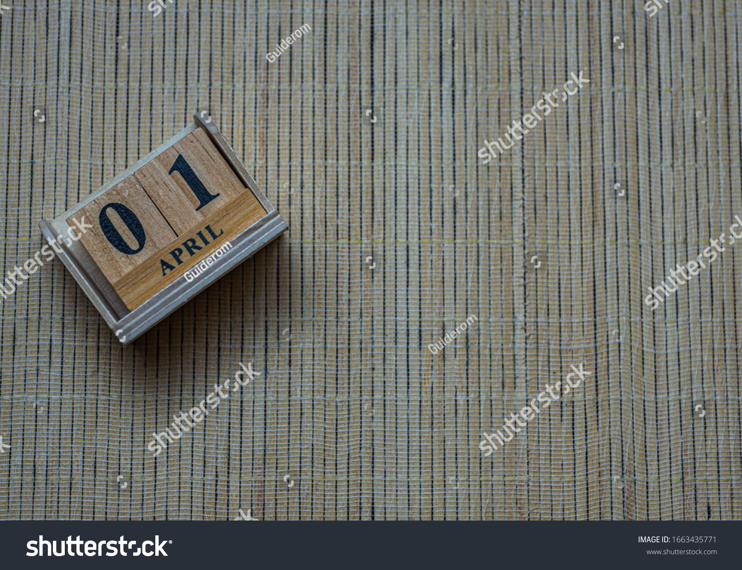 1st April blurred wooden calendar , April fool day, concept #1663435771