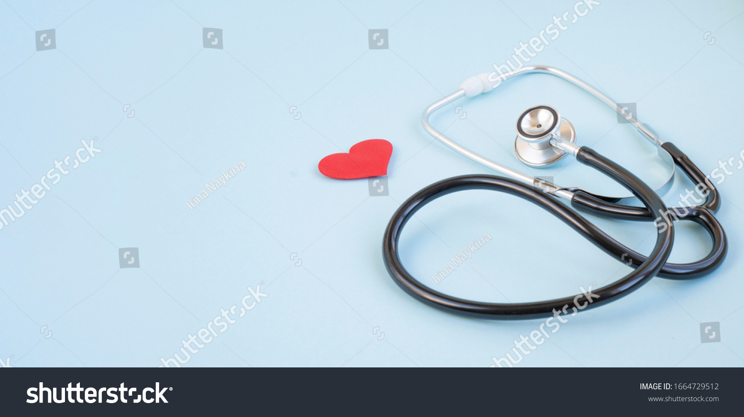 Stethoscope and red heart on a blue background. Greeting background. National doctor's day. Happy nurse 's day. Health day. Top view, a copy of the space. Thank you doctors and nurses . #1664729512