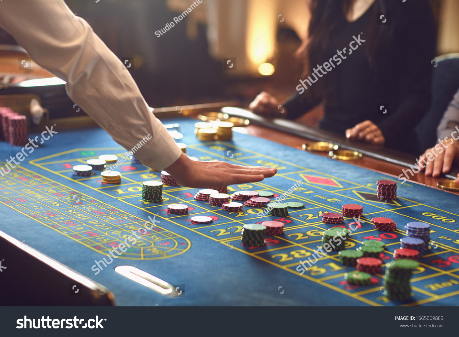 People gambling at roulette poker in a casino. #1665069889