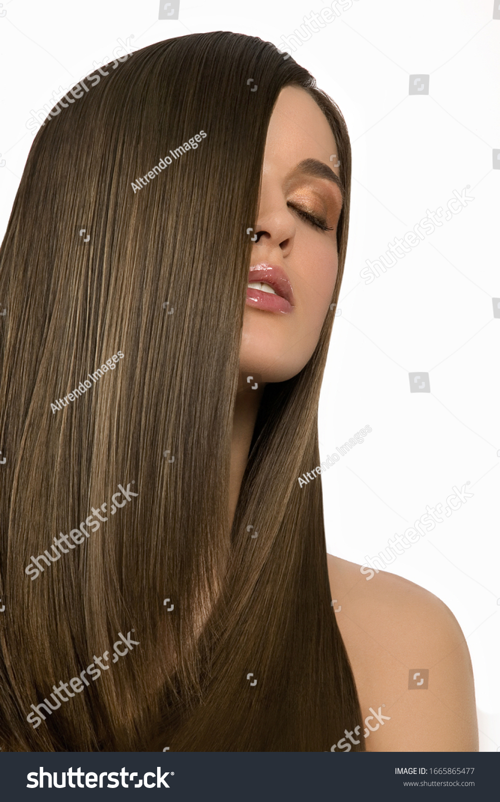 Studio shot of woman with hair in face and eyes closed #1665865477