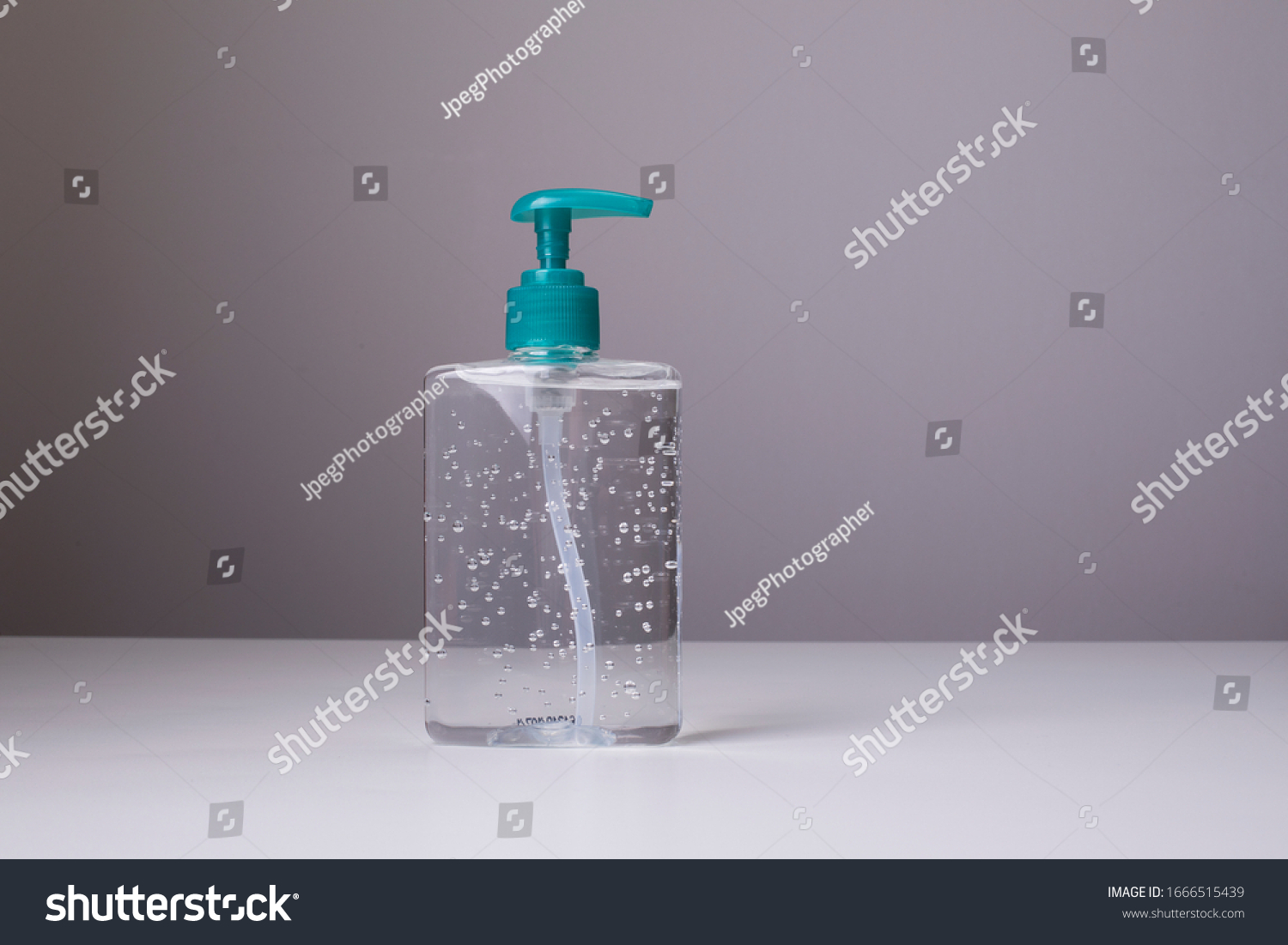 Bottle of hand sanitizer, antimicrobial liquid gel, germ prevention or antibacterial hygiene #1666515439
