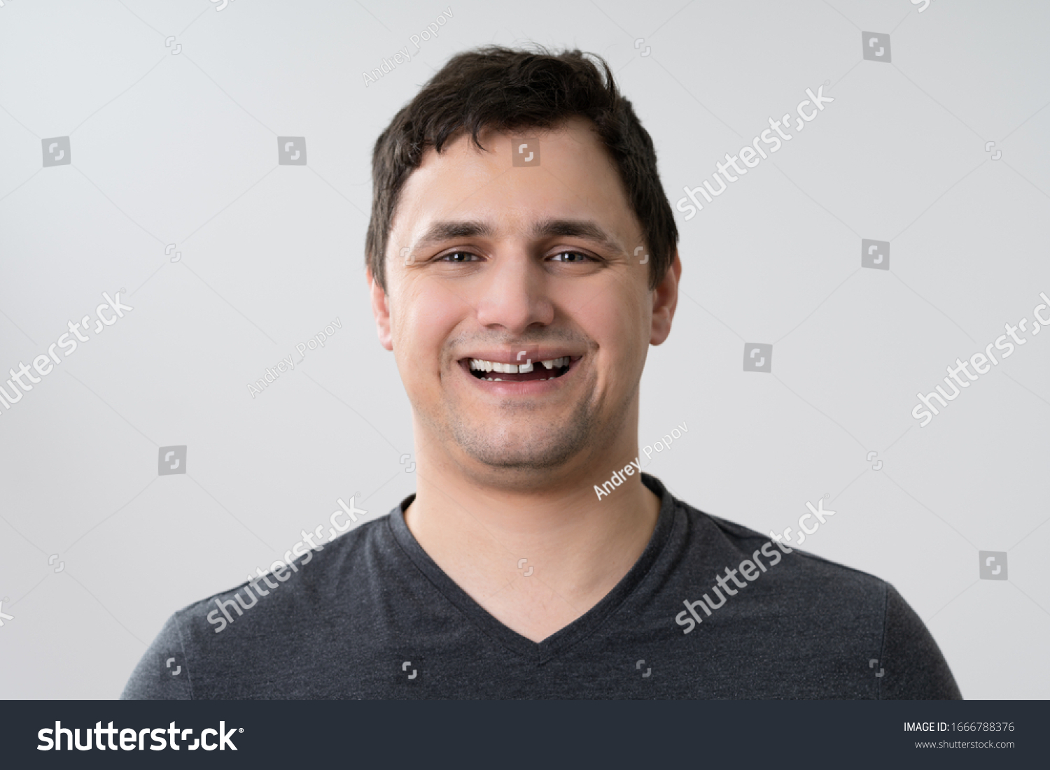 Portrait Of Young Man With Missing Tooth #1666788376