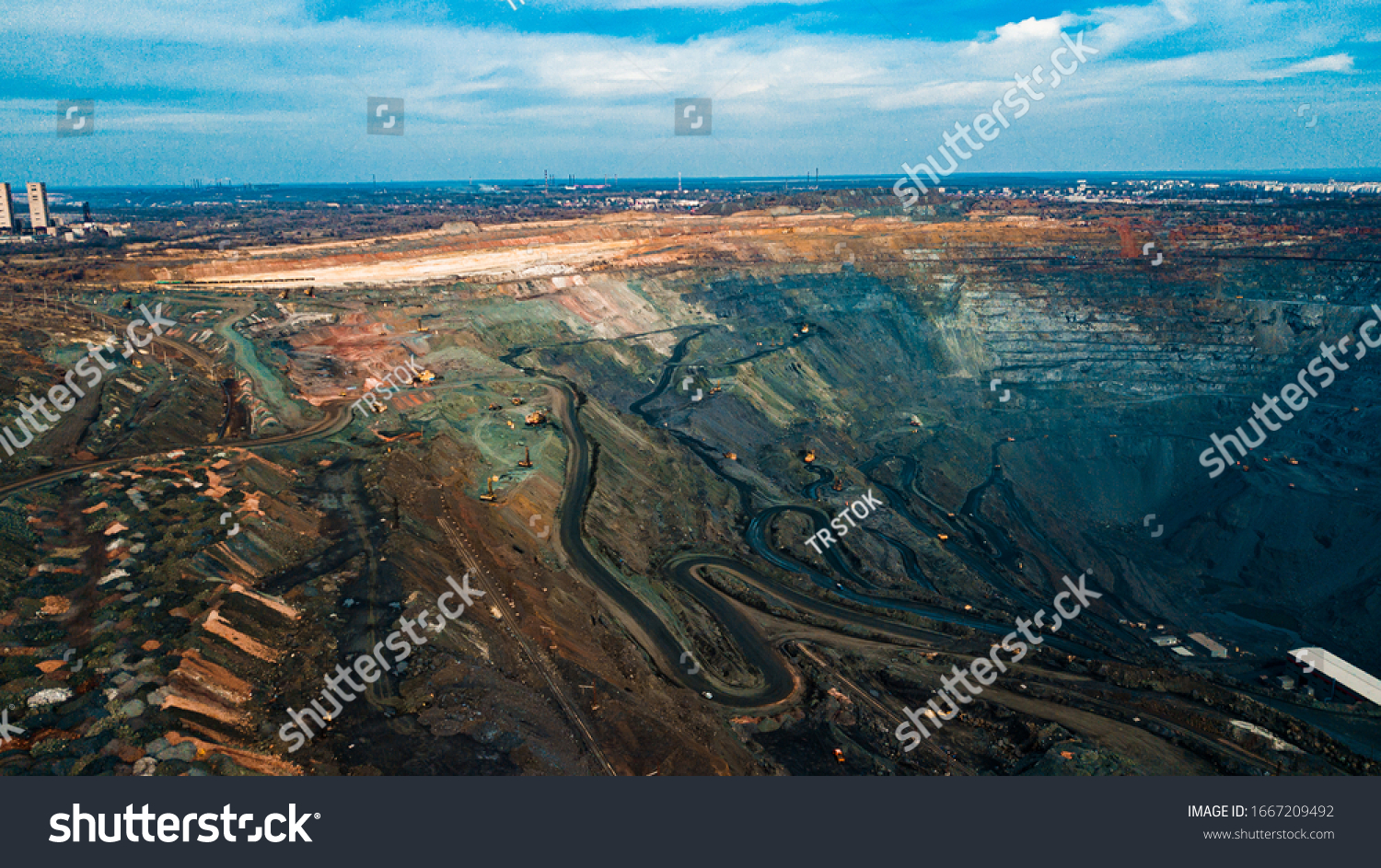 Aerial view of the Iron ore mining, Panorama of an open-cast mine extracting iron ore, preparing for blasting in a quarry mining iron ore, Explosive works on open pit #1667209492
