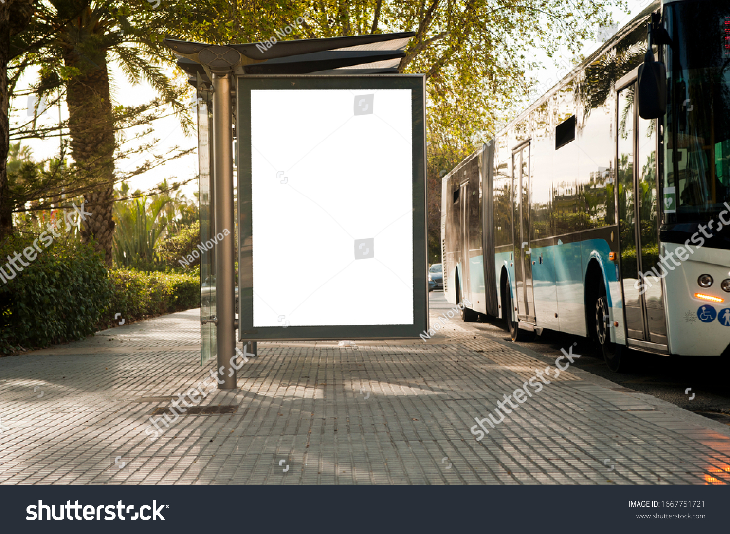 White blank vertical billboard at the bus stop on the city street. In the background of buses and roads. Sketch. Poster on the street next to the road #1667751721