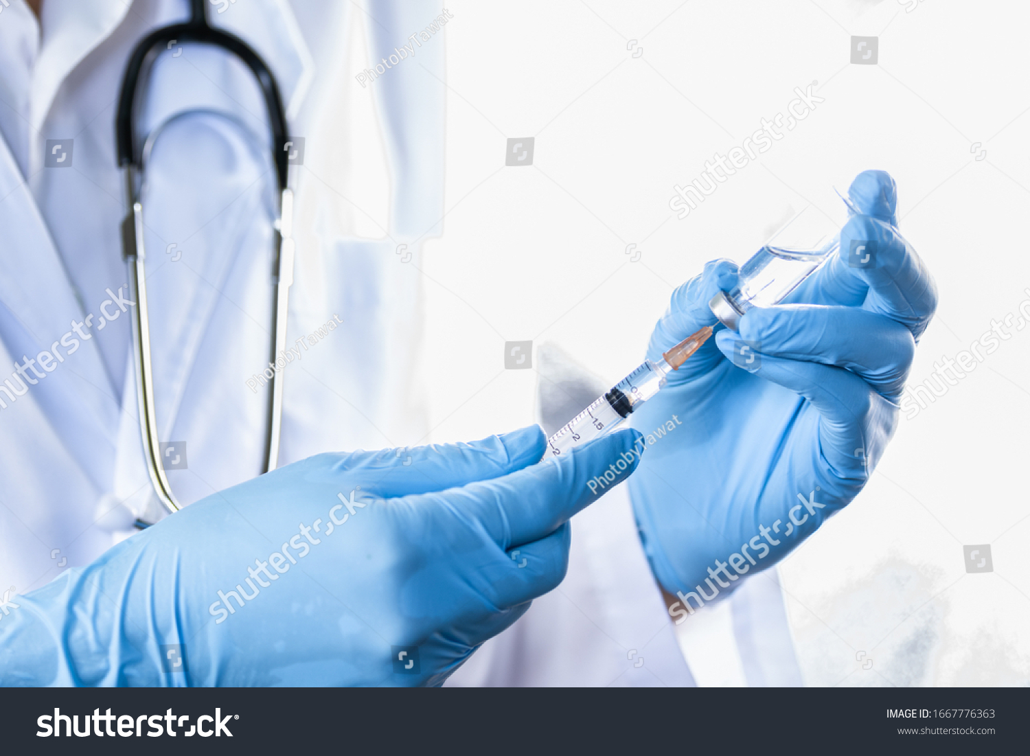 Doctor, nurse or scientist hand in blue nitrile gloves holding flu, measles, coronavirus vaccine shot for diseases outbreak vaccination, medicine and drug concept #1667776363
