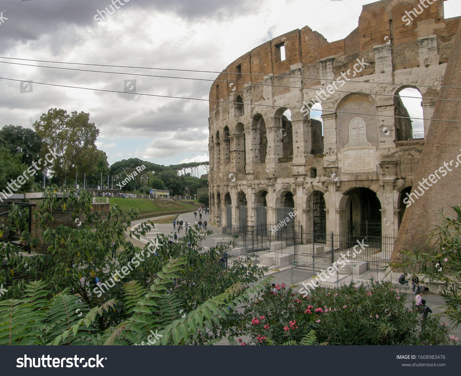 Top view of the Colosseum with a cloudy sky in the background #1668983476