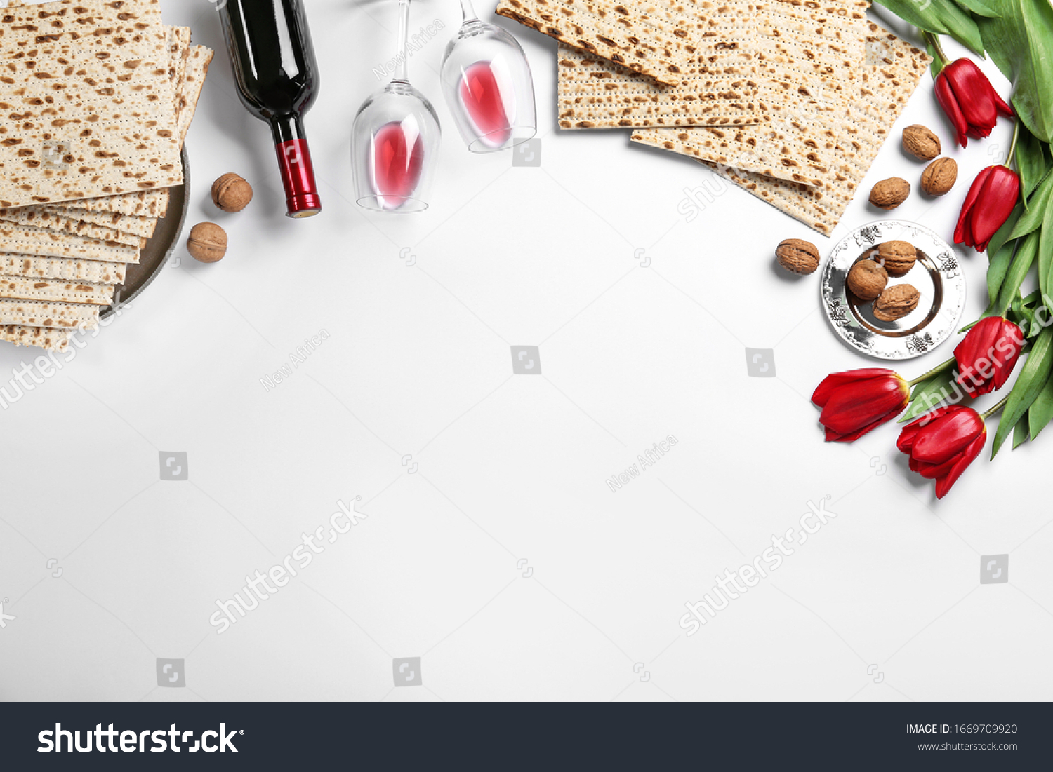 Flat lay composition with matzos on white background, space for text. Passover (Pesach) celebration #1669709920