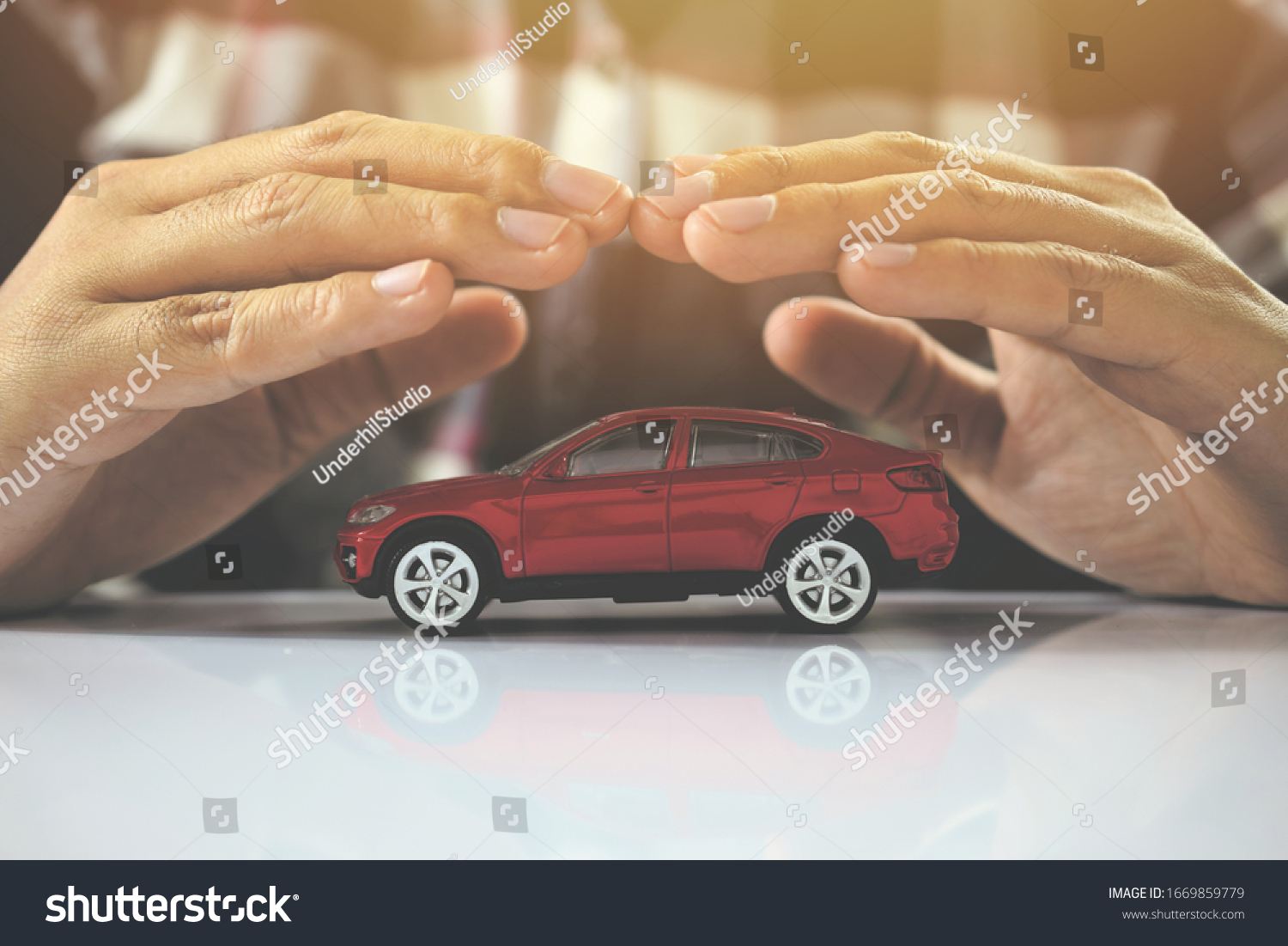Male hands and car as protection of car concept #1669859779