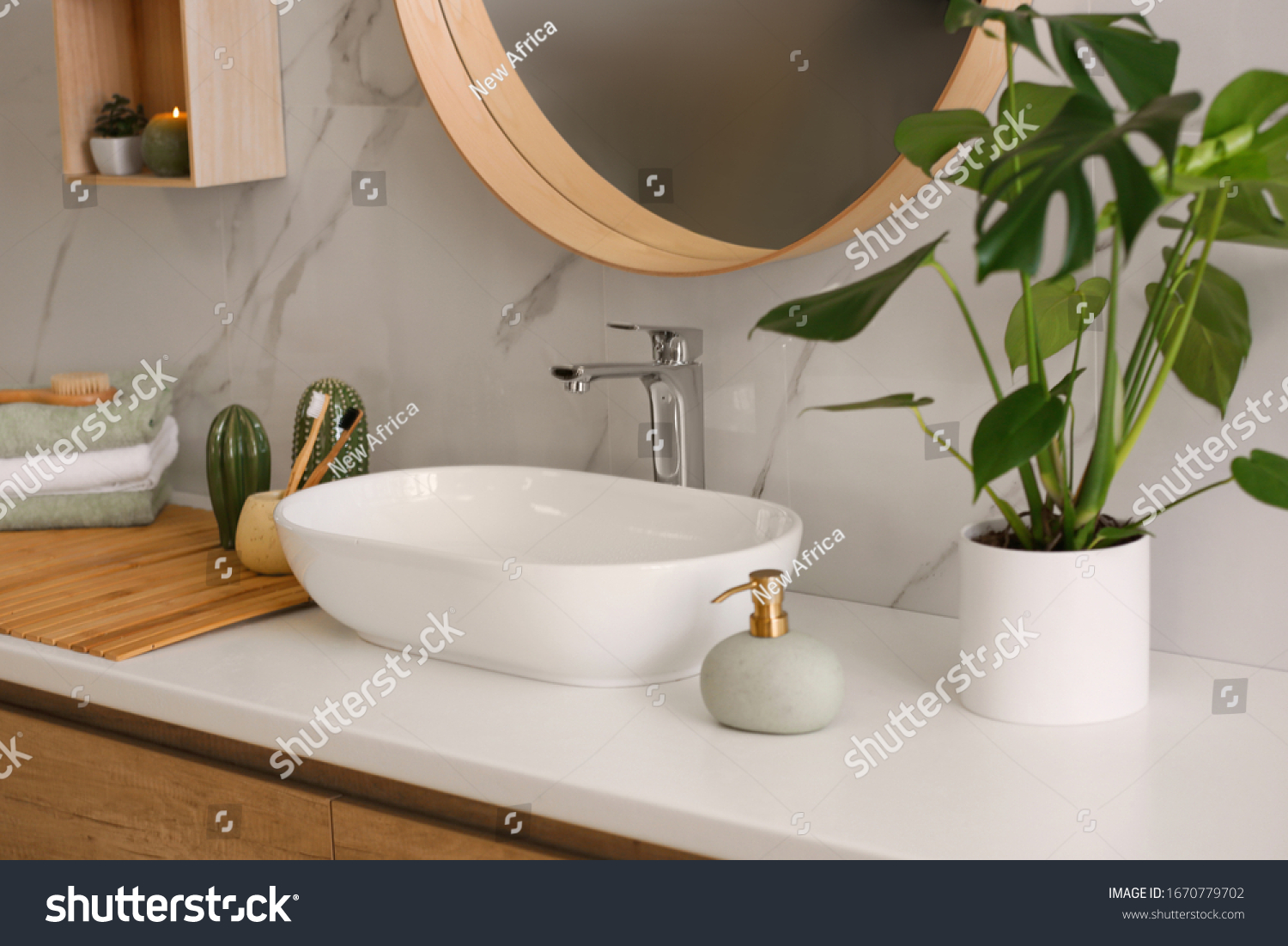 Stylish vessel sink on light countertop in modern bathroom #1670779702