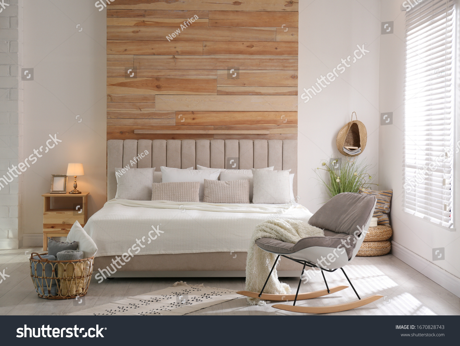Stylish room interior with big comfortable bed #1670828743
