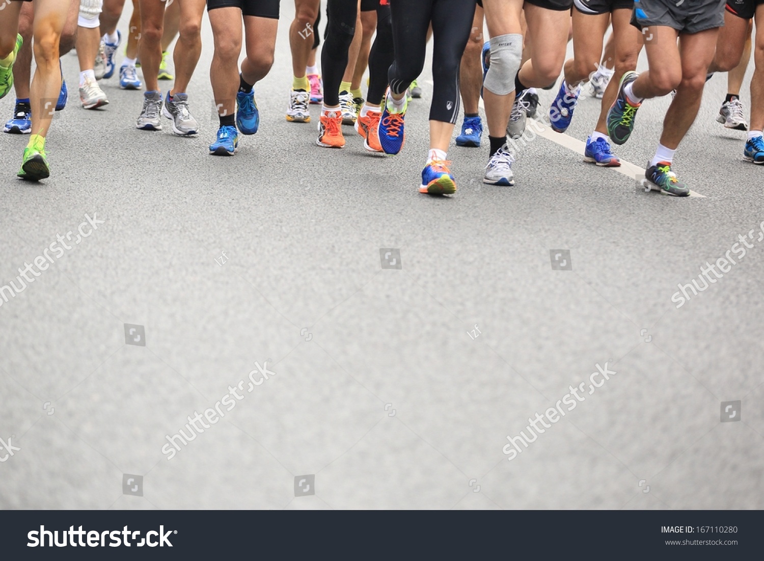 SHENZHEN - DEC 08: Unidentified athletes running at the shenzhen international marathon 2013, shennan road,shenzhen city,China,on DEC 08,2013 at Shenzhen city,Guangdong province,China.  #167110280