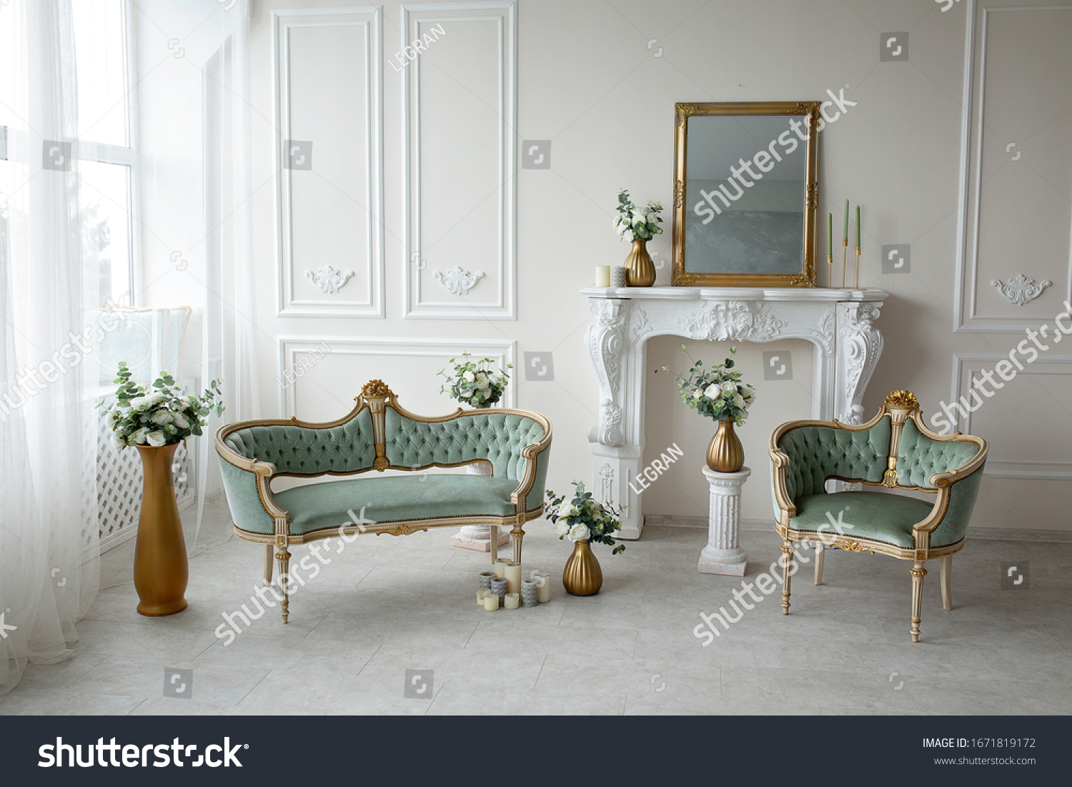 Vintage green armchairs in the interior near the fireplace #1671819172