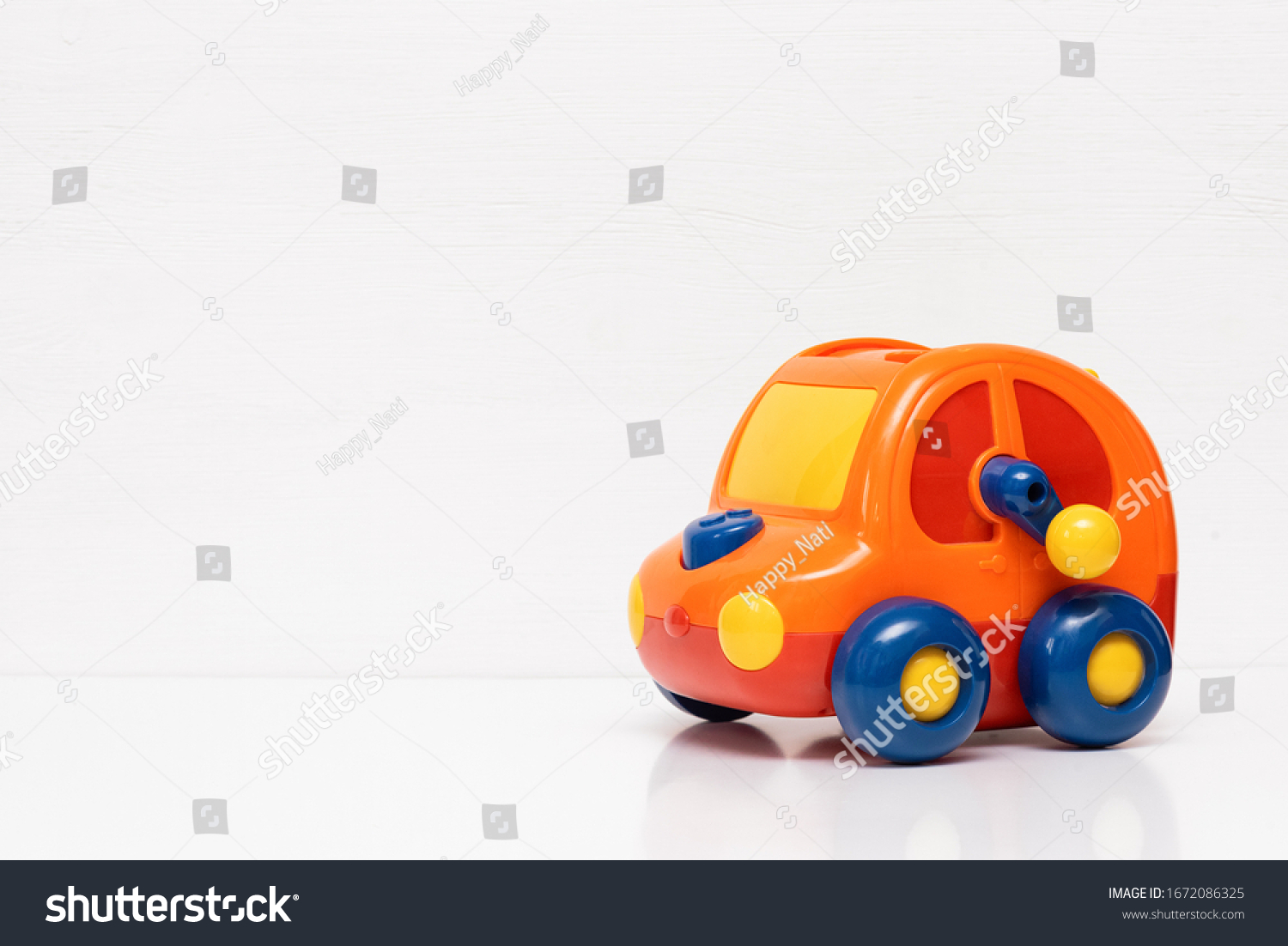 Children car toy on white background with copy space. #1672086325