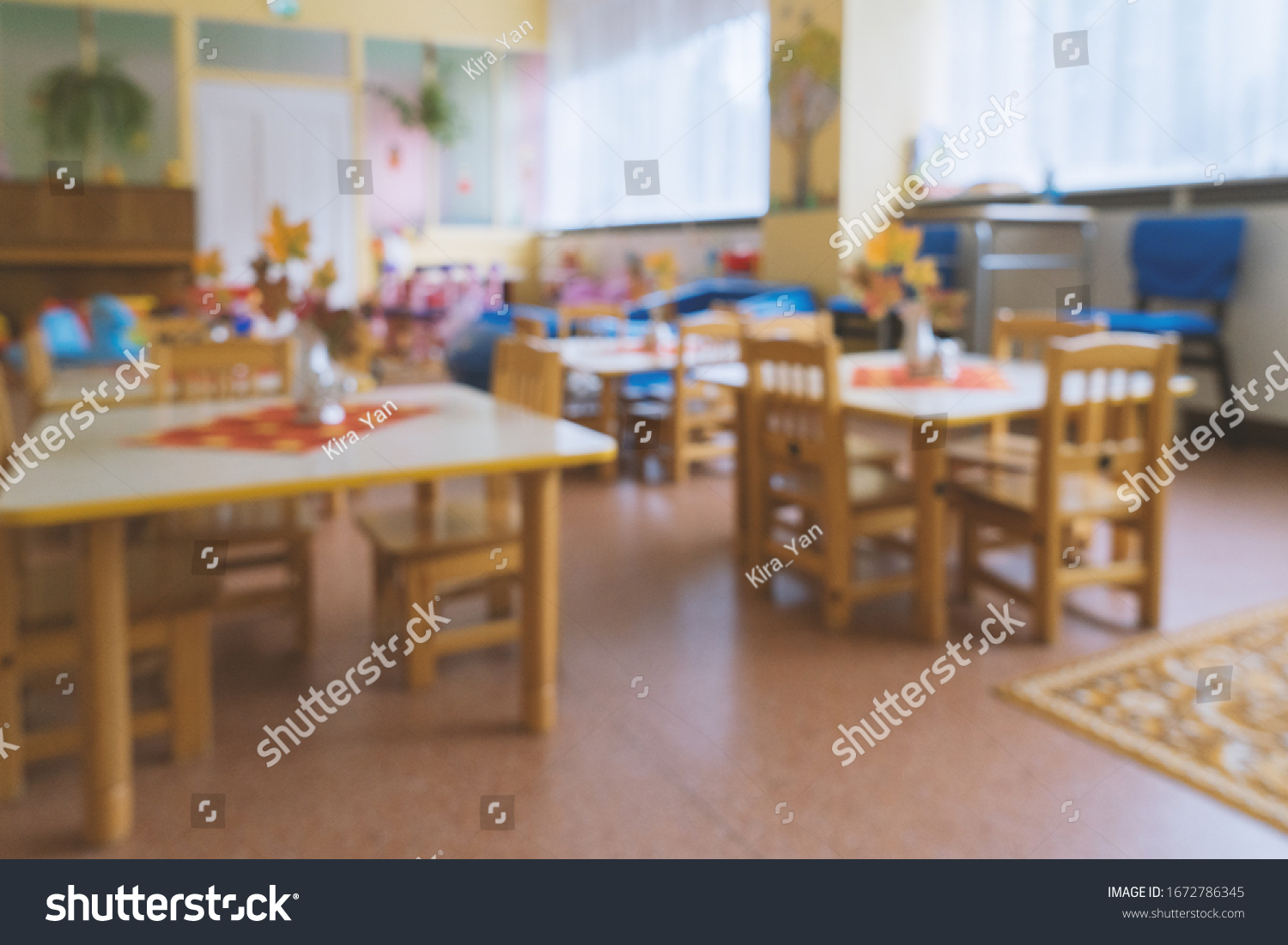 Empty blurred classroom in elementary school, kindergarten. Compulsory quarantine for all educational institutions concept #1672786345